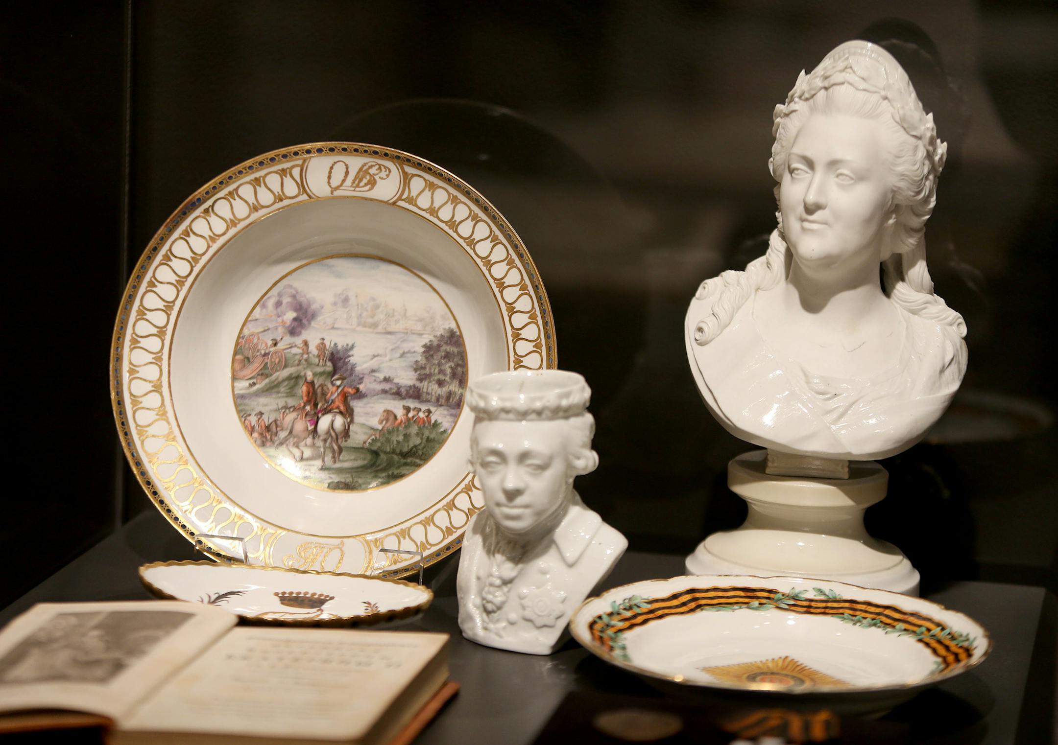 Curator Masha Zavialova prepared "The Romanovs: Legacy of an Empire Lost," at the Museum of Russian Art, Friday, November 15, 2013. The show is of memorabilia of three centuries of costumes, photos, paintings, books, jewelry from 15 museums and private collections, documenting the history of Russia's czars whose rule ended in bloody revolution of 1917. (ELIZABETH FLORES/STAR TRIBUNE) ELIZABETH FLORES • eflores@startribune.com