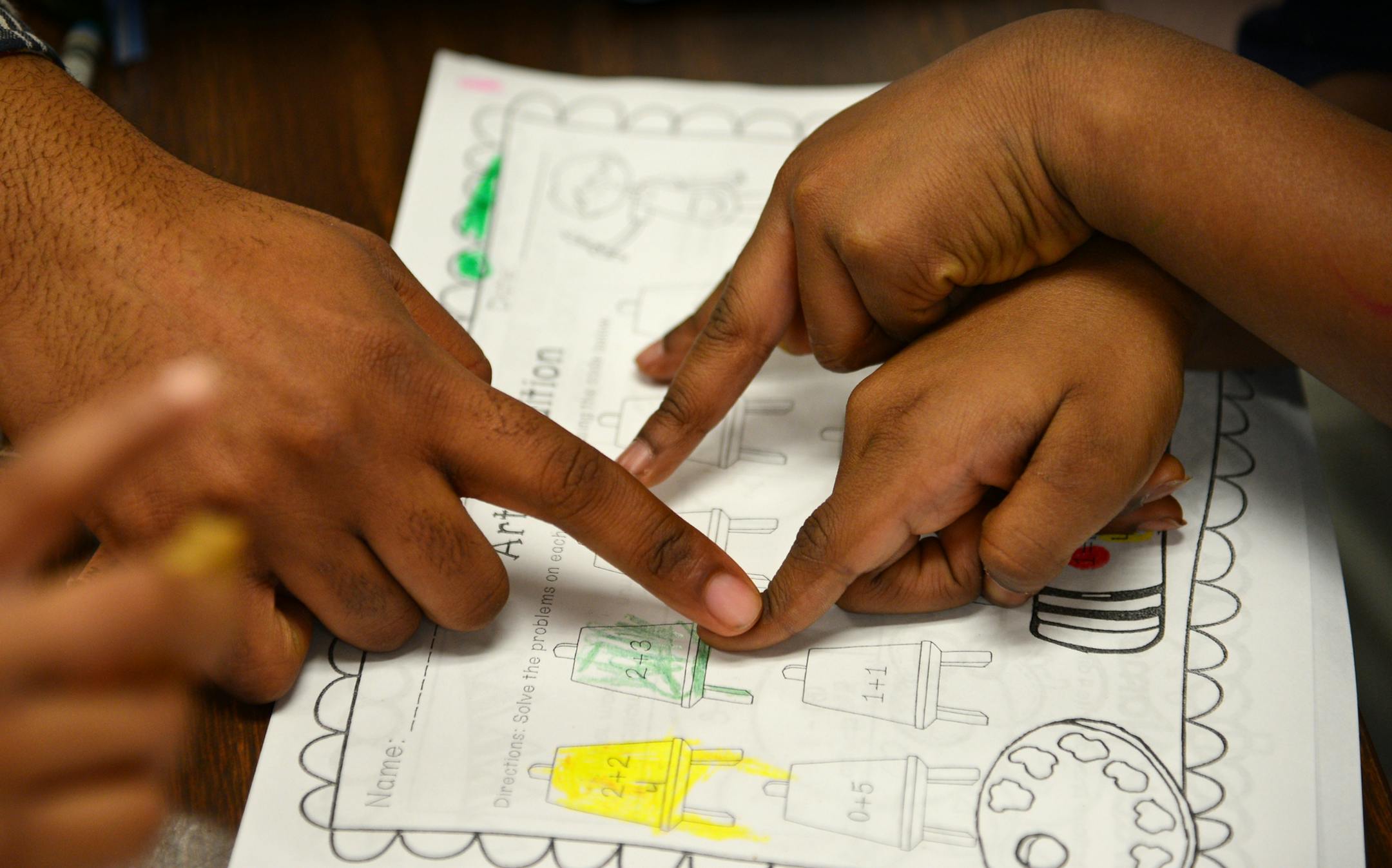 Jayden Myles is a navigator which is like a mentor who works with students in the NAZ program. He works with these young scholars one on one focusing on strengths and weaknesses of students while building esteem and improving academic outcomes. He was working on math skills with Ahzaneia Cook during an after school program ] Nellie Stone Johnson Community School is in the Northside Achievement Zone. Richard.Sennott@startribune.com Richard Sennott/Star Tribune Minneapolis , Minn.Wednesday 3/26/20