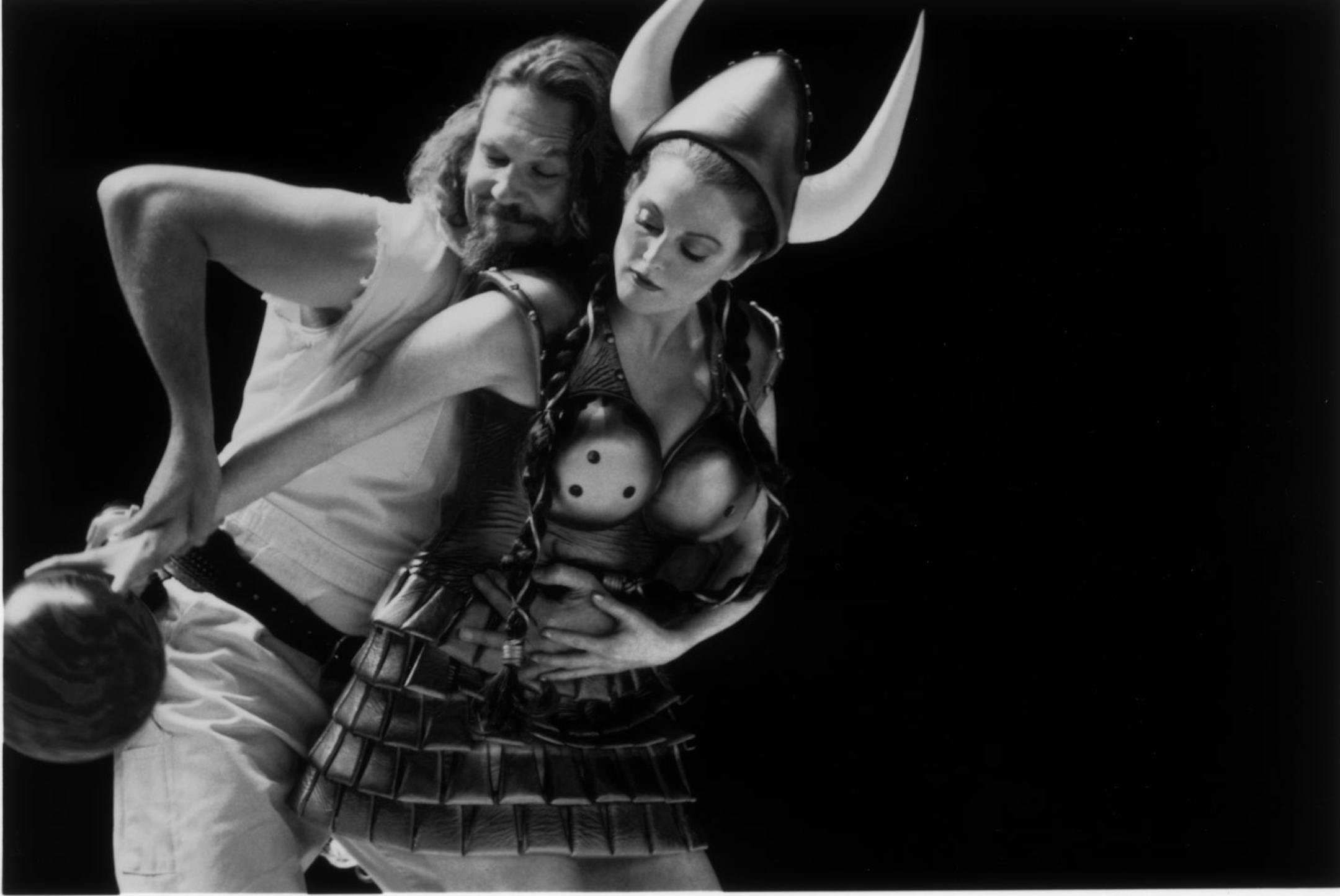 The Dude (played by Jeff Bridges, at left) has a vivid dream that includes Maude (Julianne Moore, right) as a bowling goddess in the 1998 movie THE BIG LEBOWSKI, by Ethan and Joel Coen. Handout photo by Merrick Morton, courtesy of Gramercy Pictures.