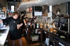 Phillip Timmons fulfills an order at the Dunn Brothers Coffee Freight House location in Minneapolis on Tuesday.