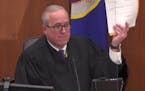 Hennepin County Judge Peter Cahill shows verdict sheets to the jury on Monday, April 19, 2021, in the trial of former Minneapolis police officer Derek