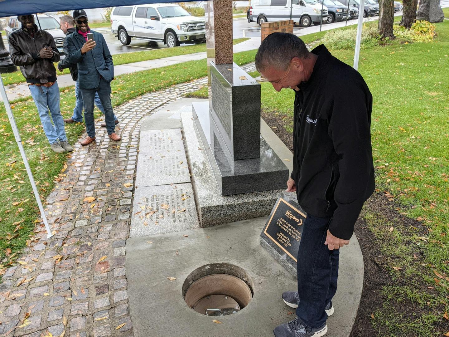 St. Cloud Mayor Dave Kleis looks at a time capsule related to COVID-19 that is marked to be opened in 100 years. (Credit: Jenny Berg)