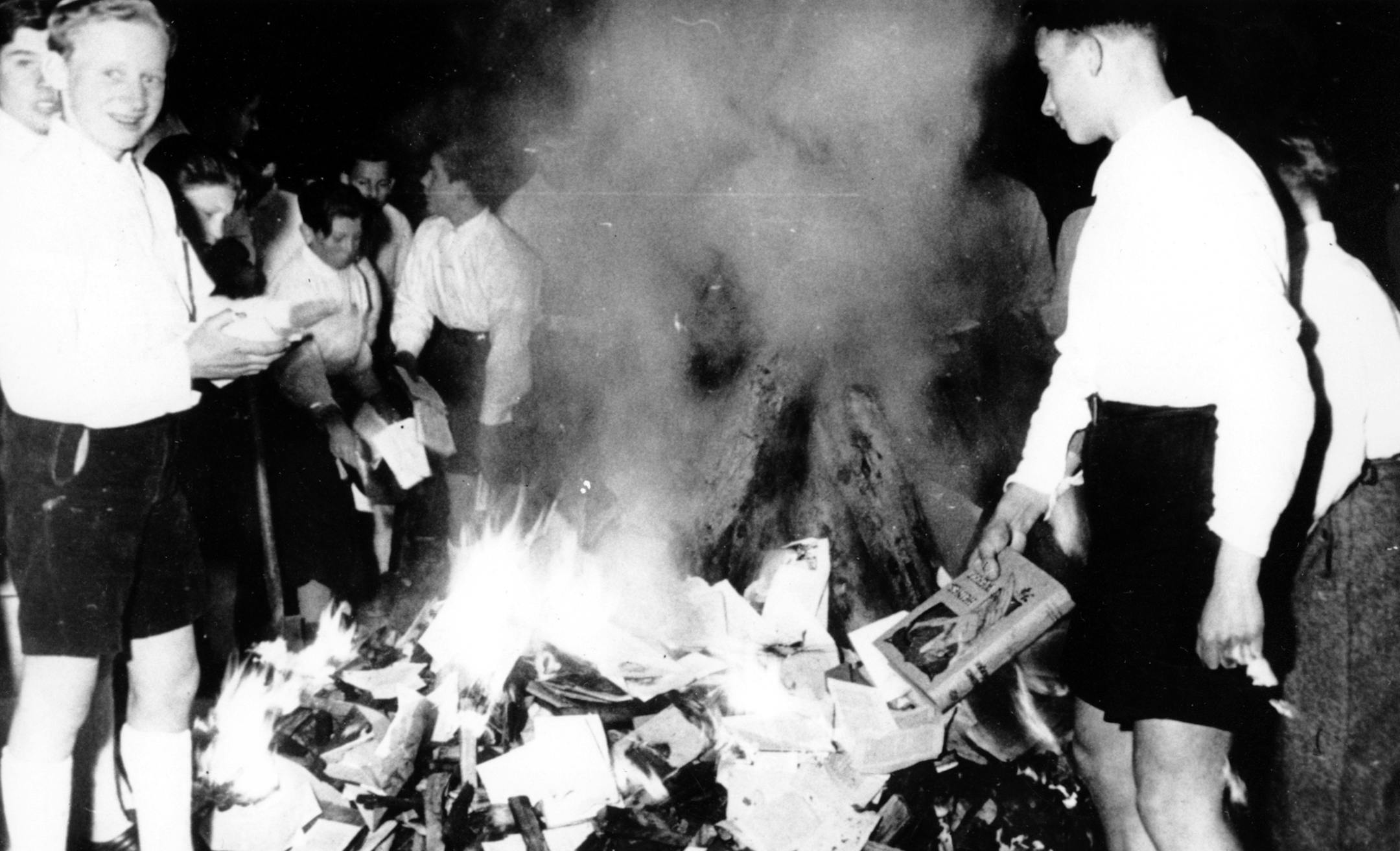 Members of the Hitler Youth participate in burning books, in Salzburg, Austria, on April 30, 1938. The burning of books that are condemned as Jewish-Marxist is a vast anti-Semitic activity of Nazi Germany. (AP Photo) ORG XMIT: APHS24681