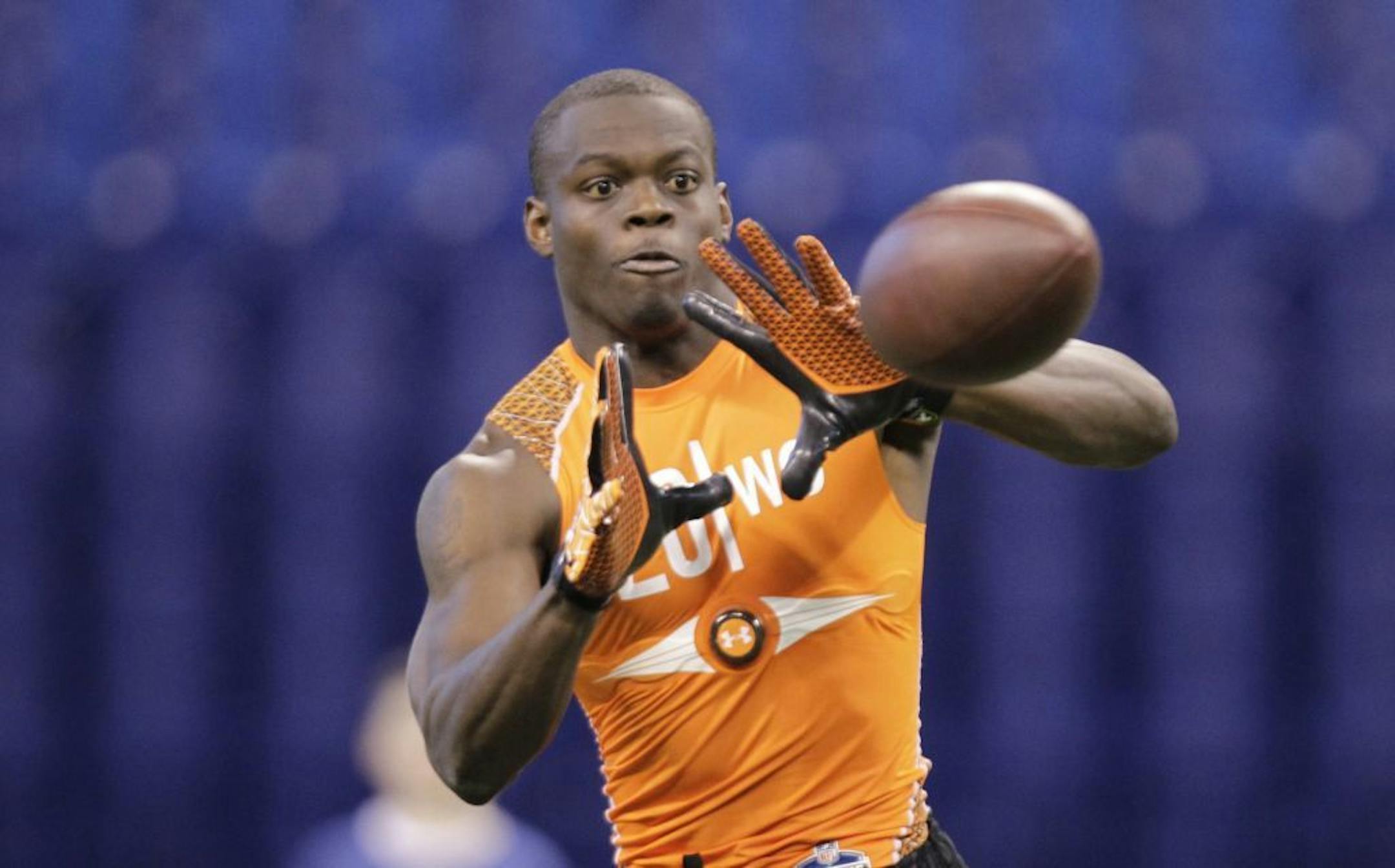 Georgia Tech receiver Stephen Hill makes a catch as he runs a drill at the NFL football scouting combine in Indianapolis, Sunday, Feb. 26, 2012.