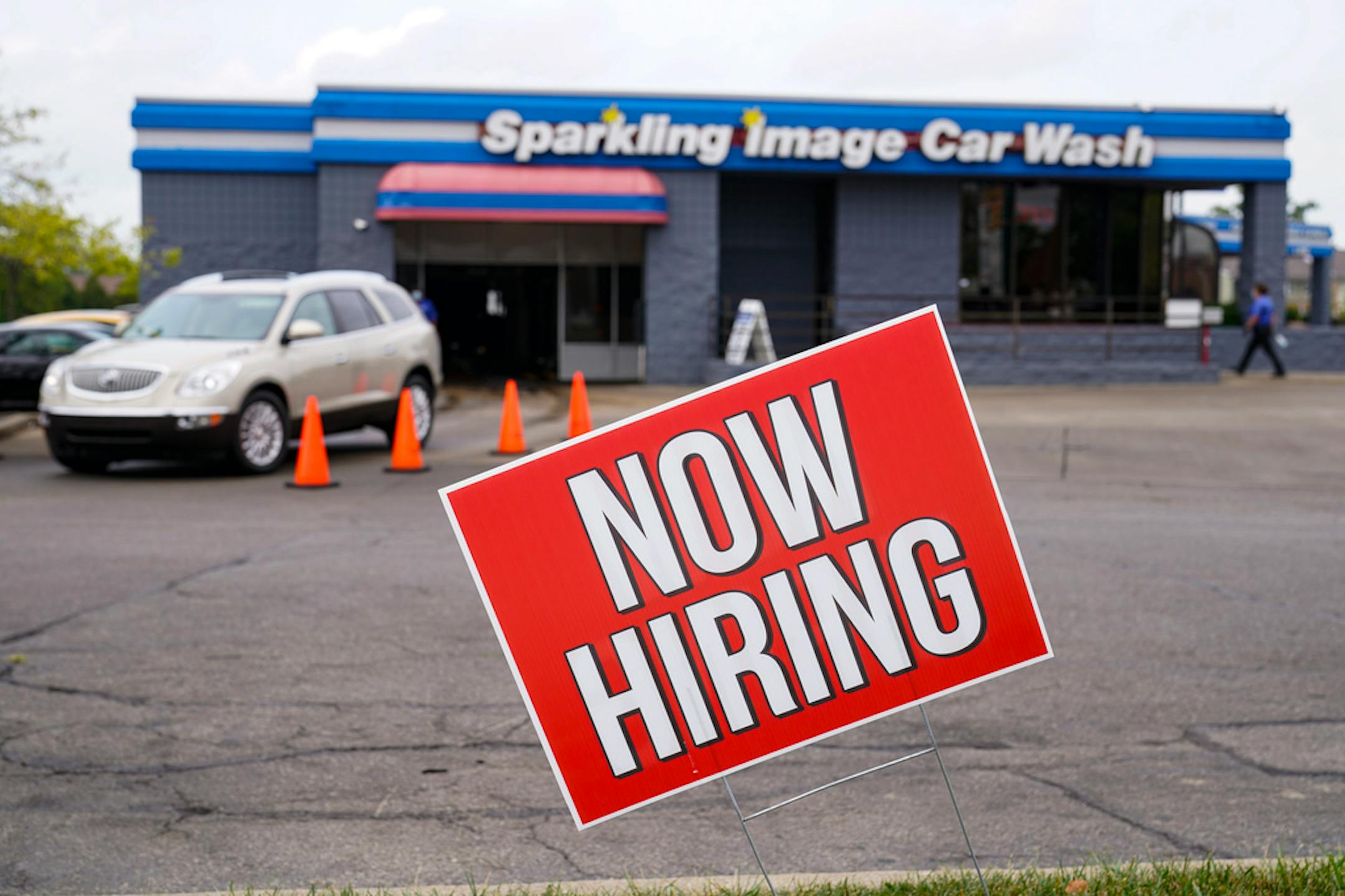FILE - In this Sept. 2, 2020, file photo, a help wanted sign is displayed at car wash in Indianapolis.