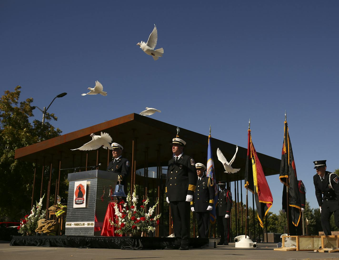 Hundreds of people attended the Minnesota Fallen Firefighter Memorial Ceremony at the monument near the State Capitol Sunday afternoon, September 29, 2013 in St. Paul. Near the end of the memorial ceremony, after the solemn tolling of the bell to honor the fallen firefighters, white doves were released. ] JEFF WHEELER &#x201a;&#xc4;&#xa2; jeff.wheeler@startribune.com