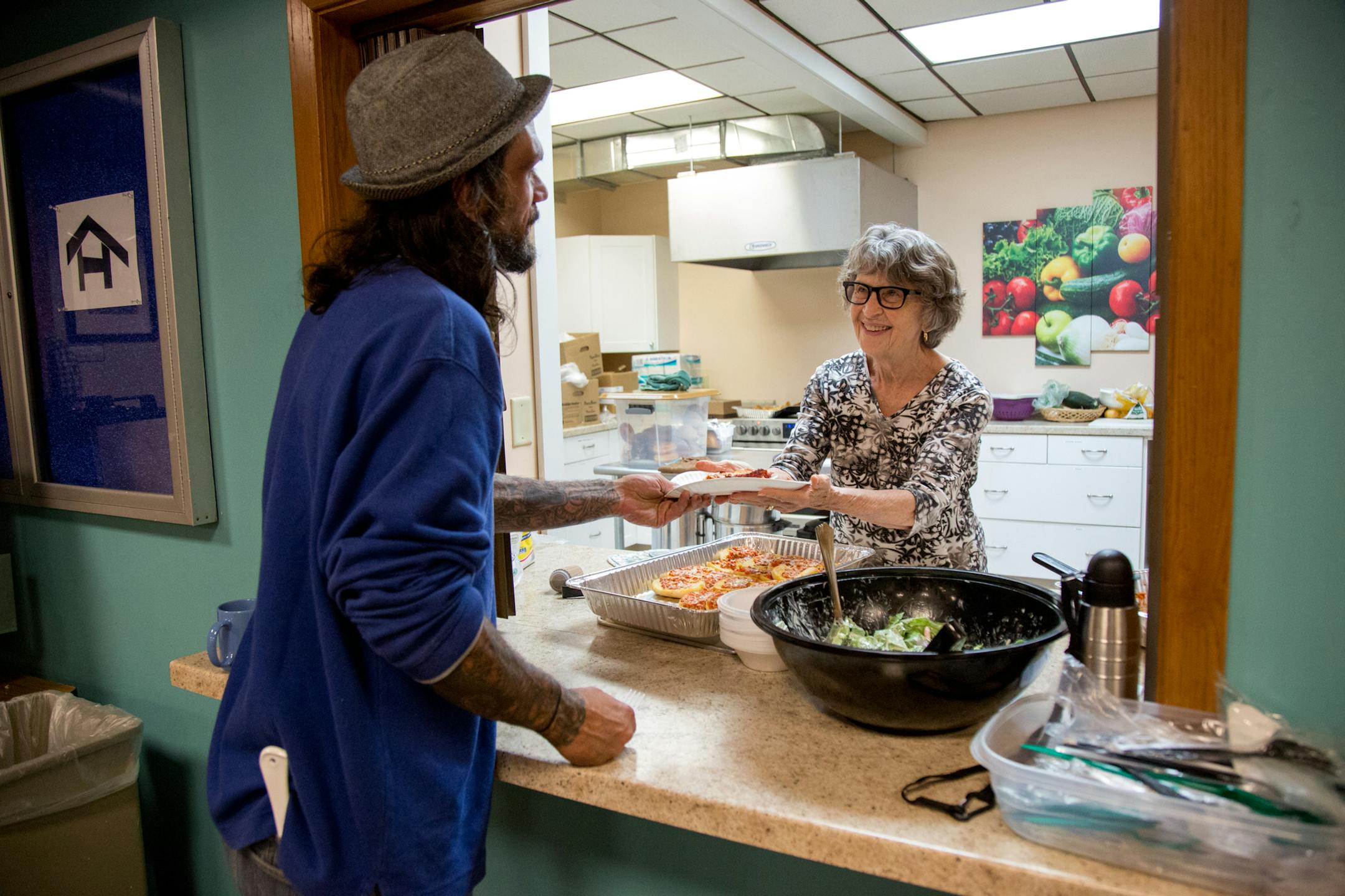 Pat Erlandson serves food at the Listening House in the First Lutheran Church basement on Thursday. ] COURTNEY PEDROZA • courtney.pedroza@startribune.com; The Listening House at First Lutheran Church; a day shelter for the homeless and needy; Aug. 3, 2017; St. Paul