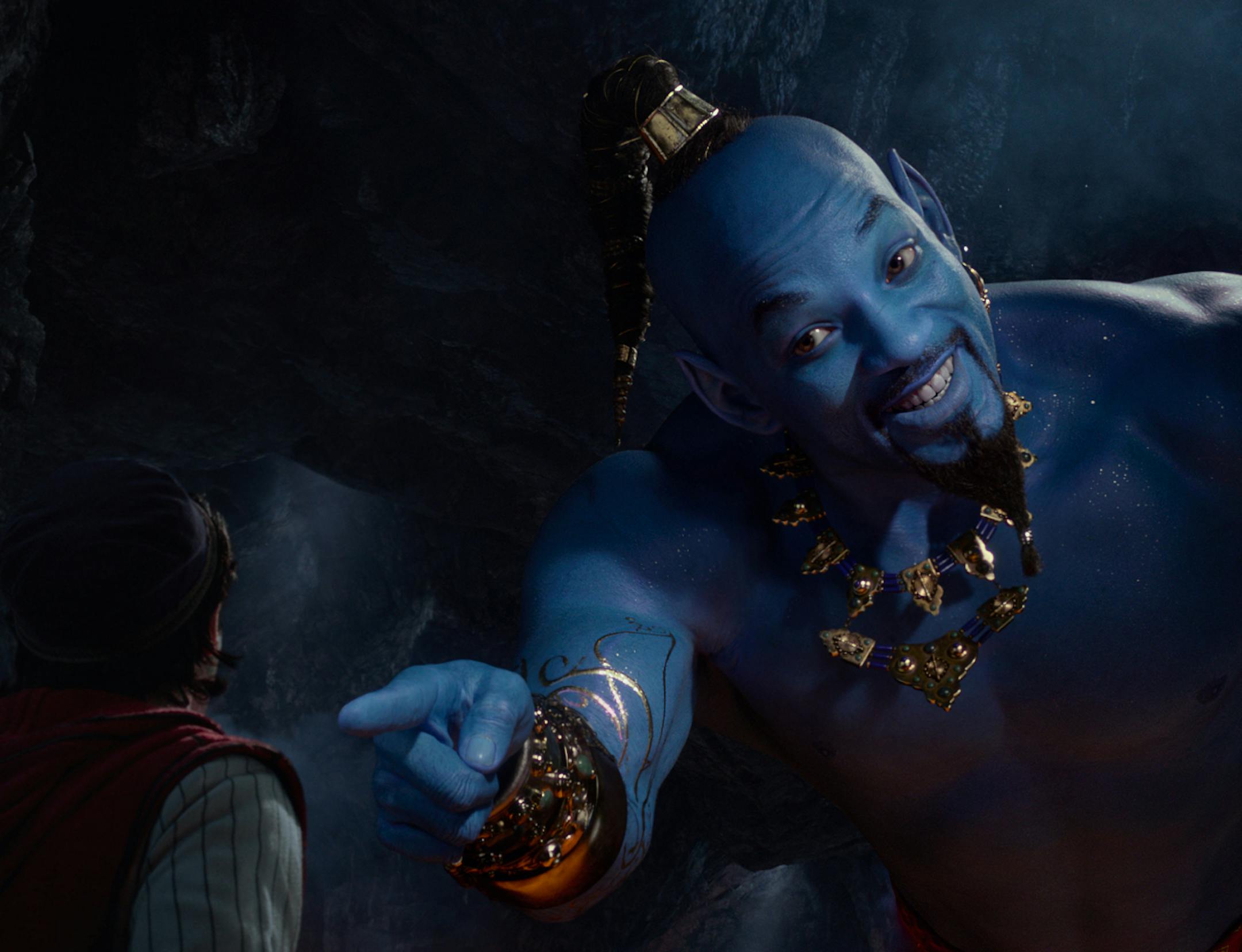 Aladdin (Mena Massoud) meets the larger-than-life blue Genie (Will Smith) in Disney’s live-action adaptation ALADDIN, directed by Guy Ritchie.