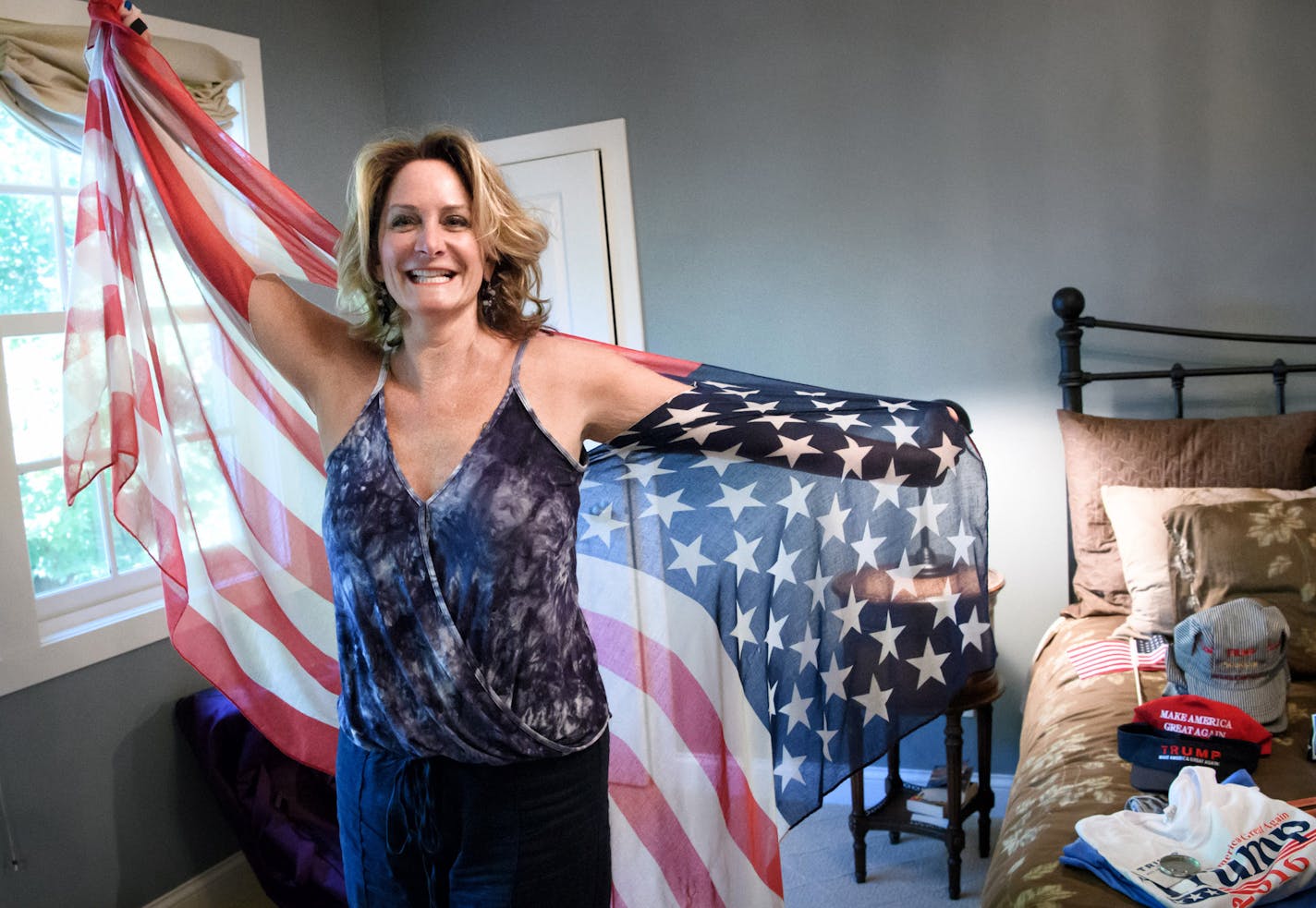 Revving up: Sheri Auclair, a Trump delegate from Wayzata, showed off a flag shawl packed for the convention.