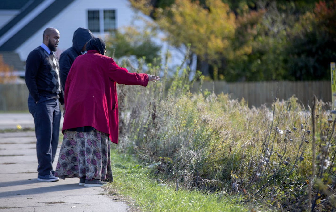 Members of the Somali-American community arrived at the scene to look over the small pond where the bodies of Bushra Abdi and Zeynab ìHapsaî Abdalla were found in a car at the site near Hwy. 41 and White Oak Drive, Monday, October 15, 2018 in Chaska, MN.