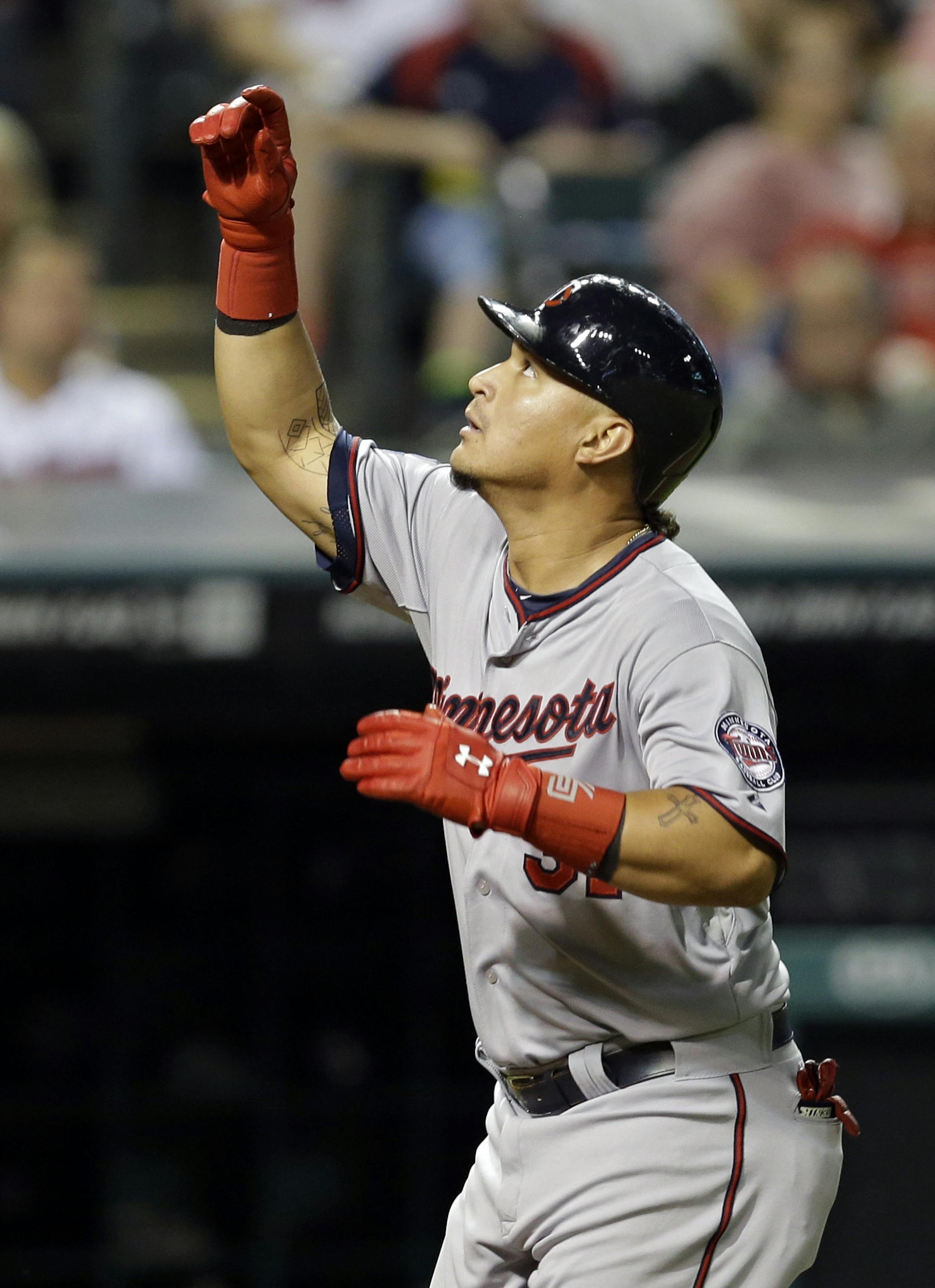 Minnesota Twins' Oswaldo Arcia celebrates his two-run home run off Cleveland Indians' Trevor Bauer in the fourth inning of a baseball game Tuesday, Sept. 9, 2014, in Cleveland. (AP Photo/Mark Duncan)