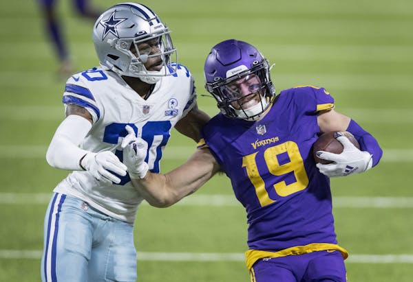 Adam Thielen of the Vikings was pushed out of bounds by Dallas' Anthony Brown in a game Nov. 22 at U.S. Bank Stadium.