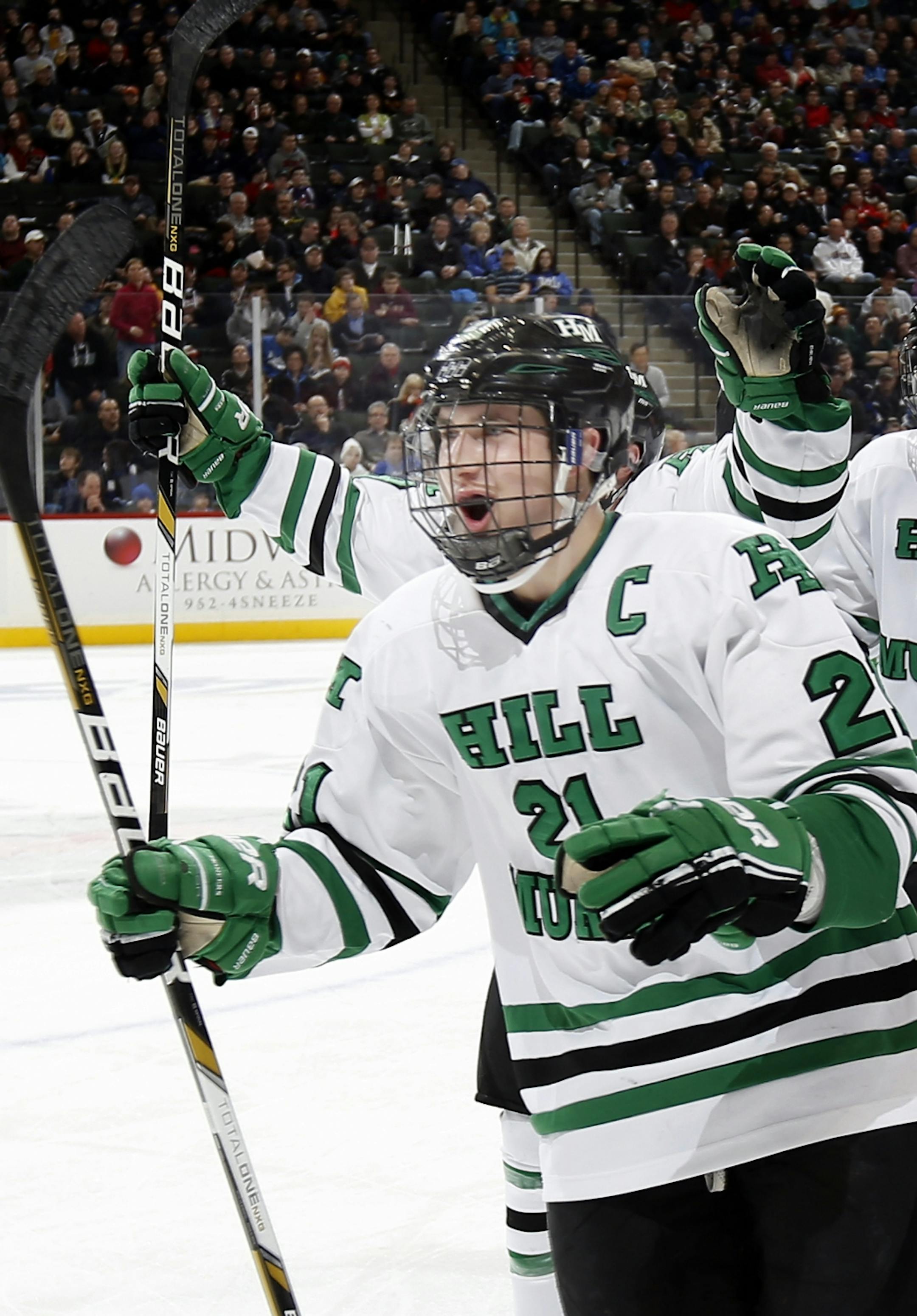 Zach LaValle (21) of Hill Murray celebrated as he skated back to the bench after scoring a goal in the first period.