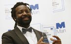 FILE - In this Oct. 13, 2015 file photo, Jamaican author Marlon James poses with the award after his book "A Brief History of Seven Killings," was nam