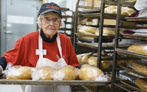 In this Jan. 9, 2019 photo, Wynnifred Franklin, 94, bags more than 250 loaves of bread a day as a bakery associate at the Giant supermarket in Audubon