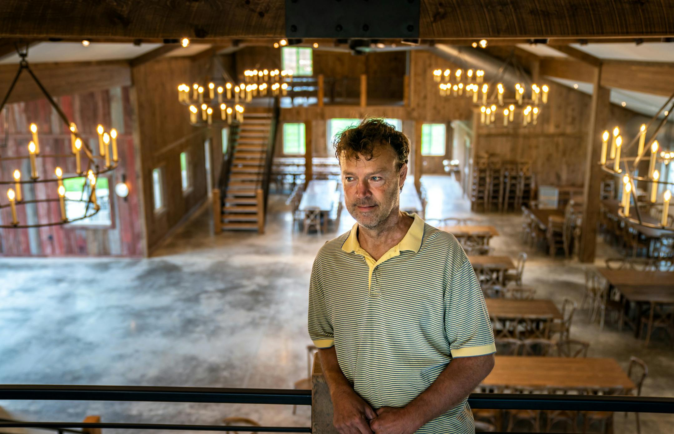 Patrick Winter, owner of Red Barn Farm in Northfield, showed off his rebuilt event barn a year after a devastating tornado. ] GLEN STUBBE • glen.stubbe@startribune.com Thursday, September 5, 2019 Patrick Winter, owner of Red Barn Farm in Northfield, showed off his rebuilt event barn a year after a devastating tornado.
