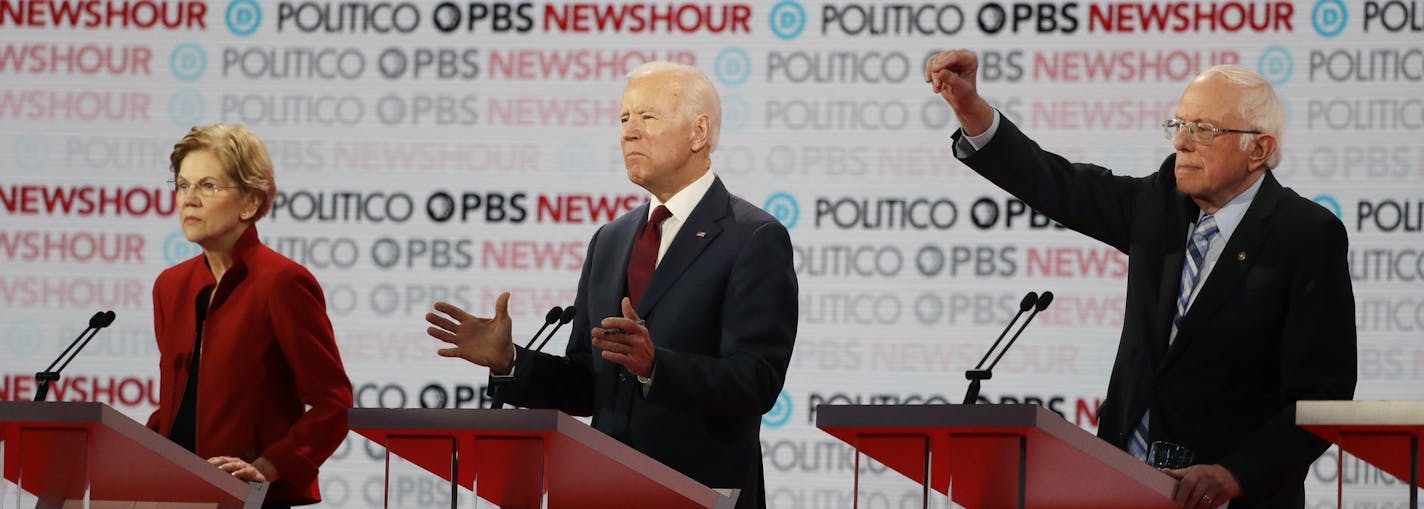 Democratic presidential candidates from left, Sen. Elizabeth Warren, D-Mass., former vice President Joe Biden and Sen. Bernie Sanders, I-Vt., participate during a Democratic presidential primary debate Thursday, Dec. 19, 2019, in Los Angeles. (AP Photo/Chris Carlson)