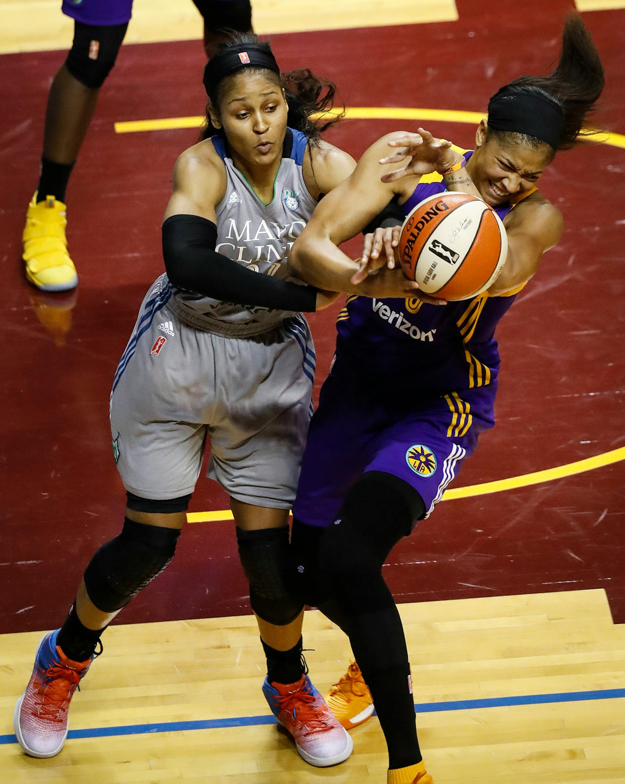 Minnesota Lynx forward Maya Moore (23) fought with Los Angeles Sparks forward Candace Parker (3) for the ball in the last moments of the second half. The Sparks won 85-84.