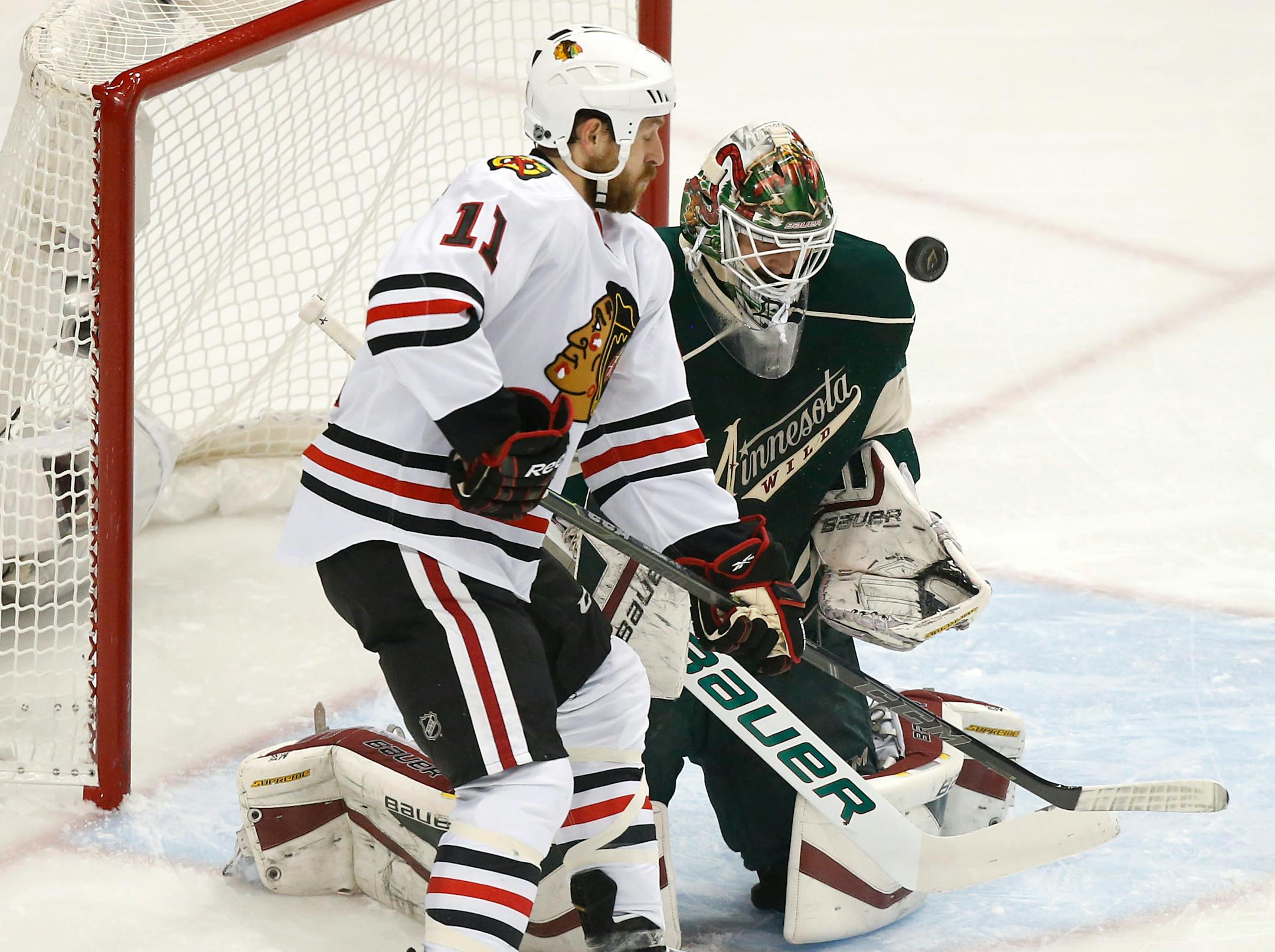 Chicago Blackhawks center Andrew Desjardins (11) attempted to score on Minnesota Wild goalie Devan Dubnyk (40) during the first period Thursday. ] CARLOS GONZALEZ cgonzalez@startribune.com, May 7, 2015, St. Paul, MN, Xcel Energy Center, NHL, Minnesota Wild vs. Chicago Blackhawks, Game 4, Stanley Cup Playoffs, Round 2