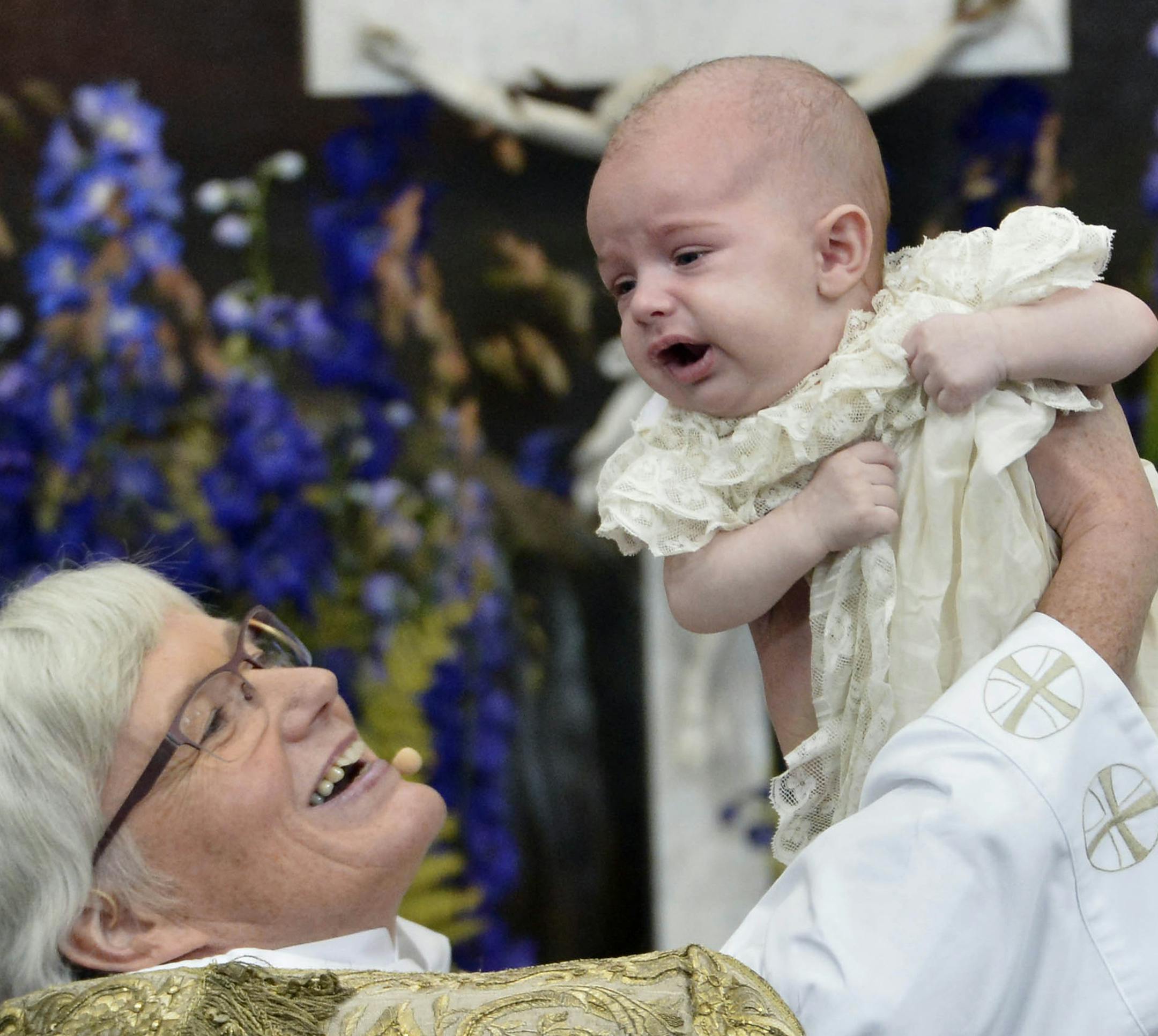 Swedish Arch Bishop Antje Jackelen raises Prince Nicolas during his christening ceremony, at the Drottningholm Palace Church, near Stockholm, Sweden, Sunday, Oct. 11, 2015. The son of Sweden's Princess Madeleine and New York banker Christopher O'Neill has been baptized near Stockholm. Prince Nicolas Paul Gustaf, also to be known as the Duke of Angermanland after a province in northern Sweden, is the first grandson of King Carl XVI Gustaf, who has two granddaughters. Nicolas was born on June 15 i