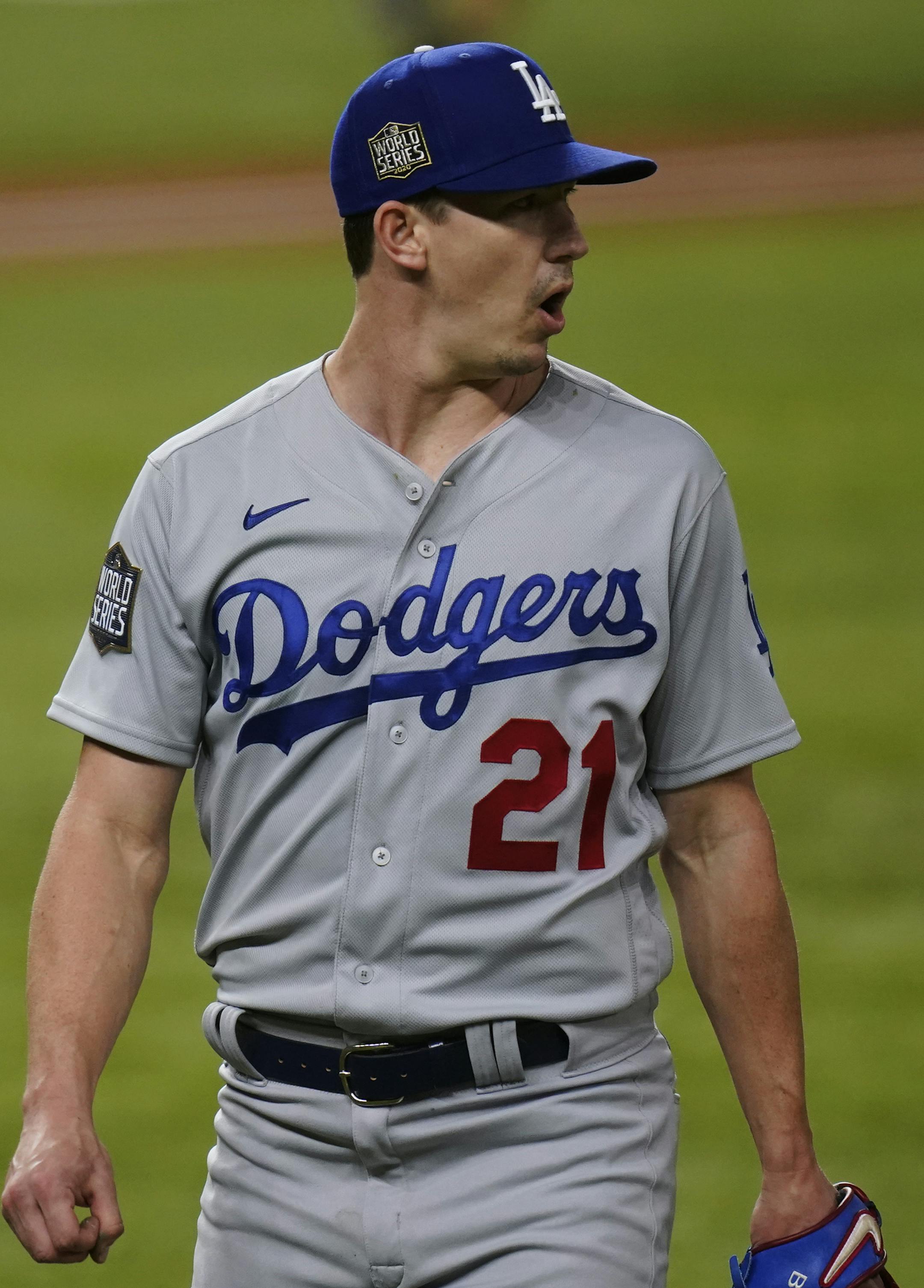 Los Angeles Dodgers starting pitcher Walker Buehler celebrates the end of the third inning against the Tampa Bay Rays in Game 3 of the baseball World Series Friday, Oct. 23, 2020, in Arlington, Texas. (AP Photo/Eric Gay)