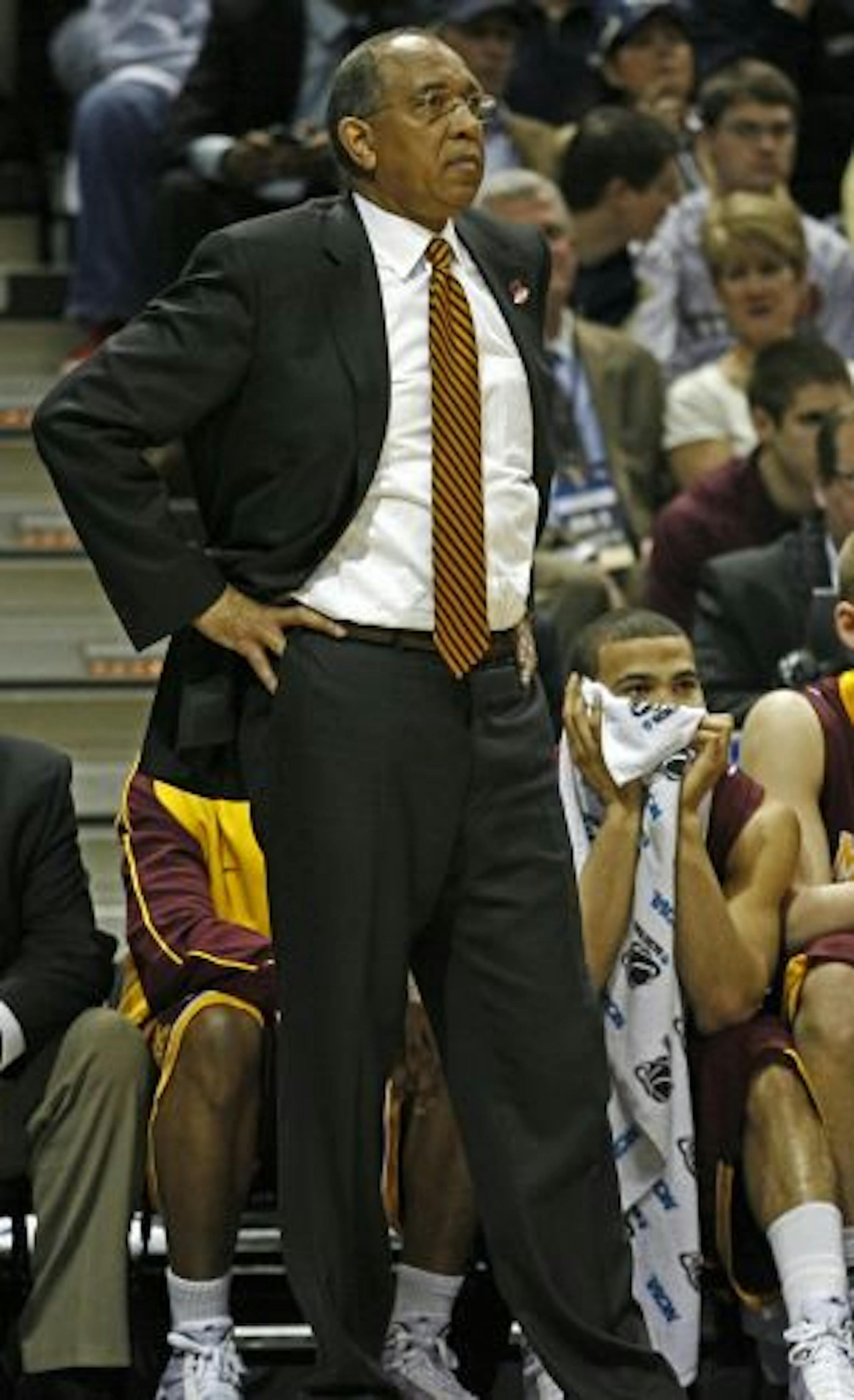 Gophers head coach Tubby Smith and Justin Cobbs watched from the sideline as time expired in the game.