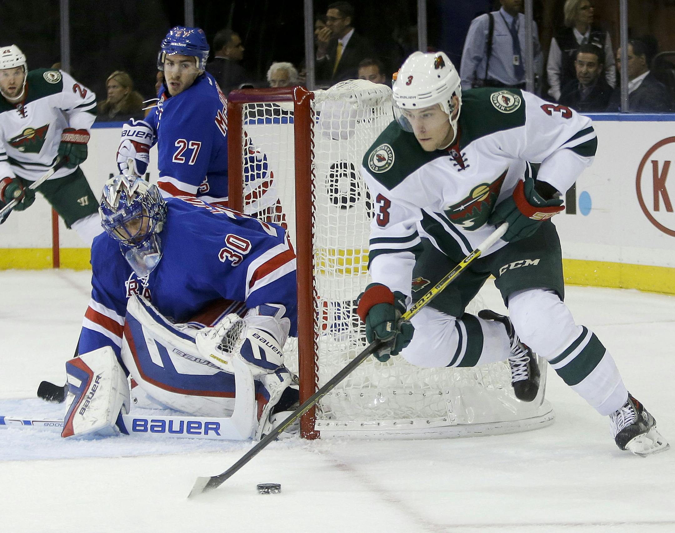 New York Rangers goalie Henrik Lundqvist (30), of Sweden, watches Minnesota Wild's Charlie Coyle (3) during the first period of an NHL hockey game Monday, Oct. 27, 2014, in New York. (AP Photo/Frank Franklin II)