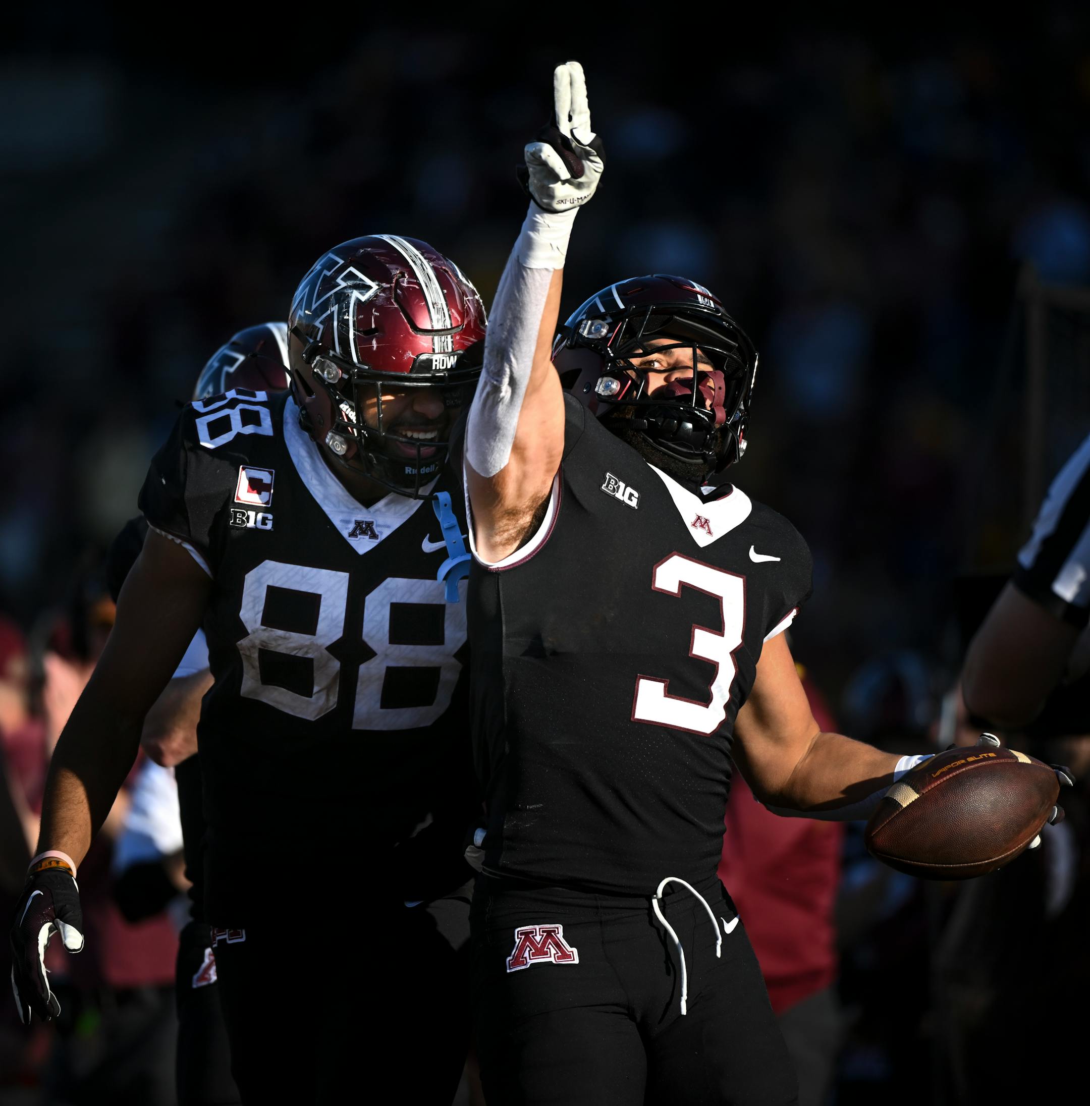 Minnesota Golden Gophers running back Trey Potts (3) and tight end Brevyn Spann-Ford (88) celebrate a first down run by Potts.