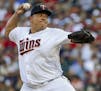 FILE - In this July 18, 2017, file photo, Minnesota Twins starting pitcher Bartolo Colon throws to the New York Yankees in the first inning of a baseb
