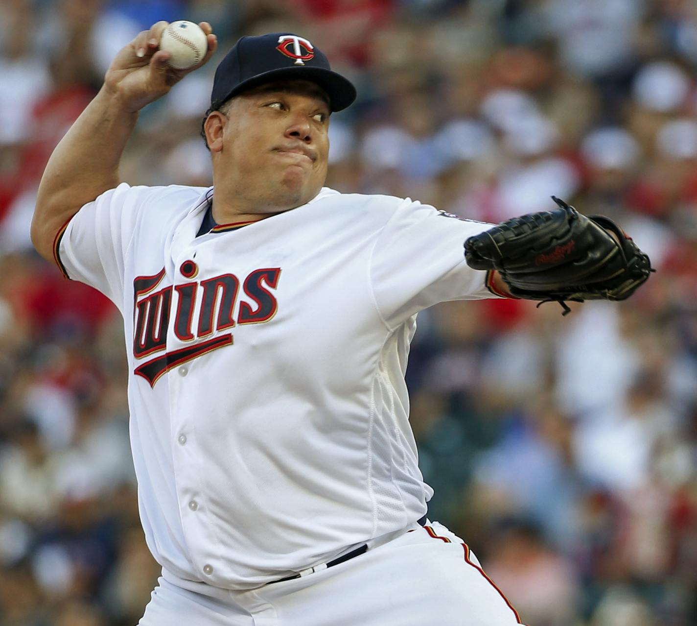 FILE - In this July 18, 2017, file photo, Minnesota Twins starting pitcher Bartolo Colon throws to the New York Yankees in the first inning of a baseball game in Minneapolis. The Twins have entered the final five-week stretch of the season with a surprising hold on the AL's second wild card spot. The peculiar-at-the-time pickup of 44-year-old pitcher Bartolo Colon has proven to be an important part of this surge.(AP Photo/Bruce Kluckhohn, File)