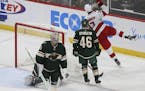 Minnesota Wild's goalie Devan Dubnyk (40) reacts to the game winning goal by Carolina Hurricanes' Andrei Svechnikov (37) of Russia in overtime of an N