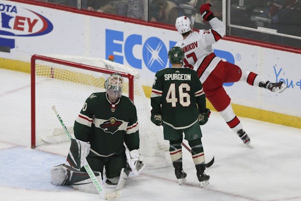Minnesota Wild's goalie Devan Dubnyk (40) reacts to the game winning goal by Carolina Hurricanes' Andrei Svechnikov (37) of Russia in overtime of an N