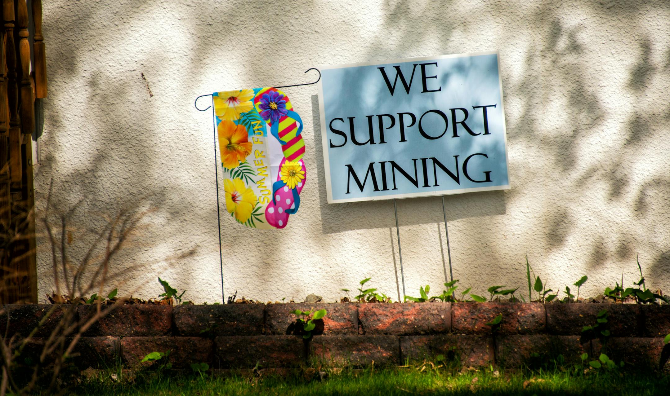Signs supporting mining in the front yard of a home in Hibbing , Minnesota, part of the huge 8th congressional district. Mining and environmental advocates are pitted against each other in this complicated issue in the district. Thursday, May 29, 2014 ] GLEN STUBBE * gstubbe@startribune.com