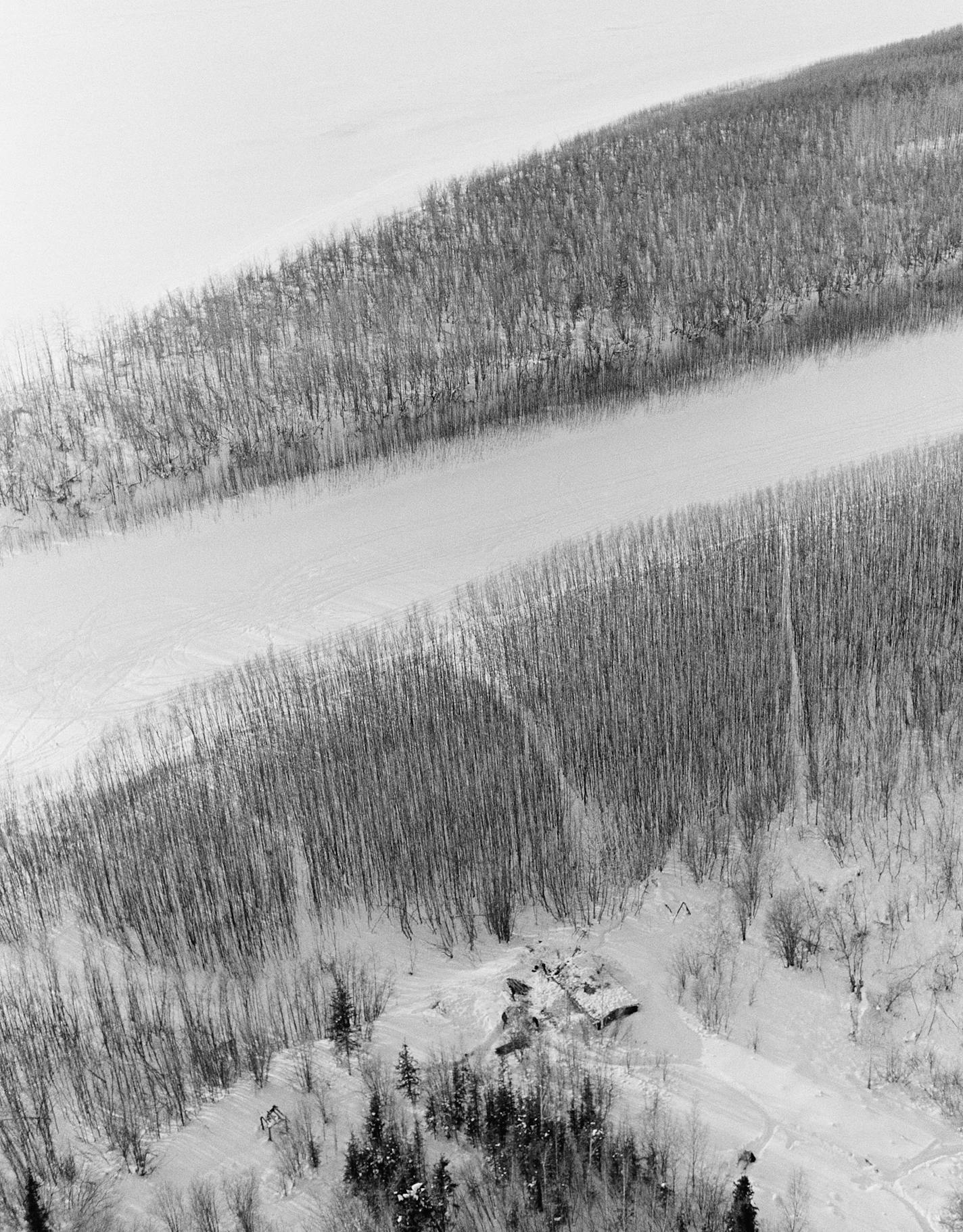 An aerial view shows the Holland's cabin in the foreground with the Yukon River beyond it, in the ice-bound wilderness 150 miles north of Fairbanks, Alaska, Jan. 4, 1972. (AP Photo/John Metzger) ORG XMIT: APHS85770