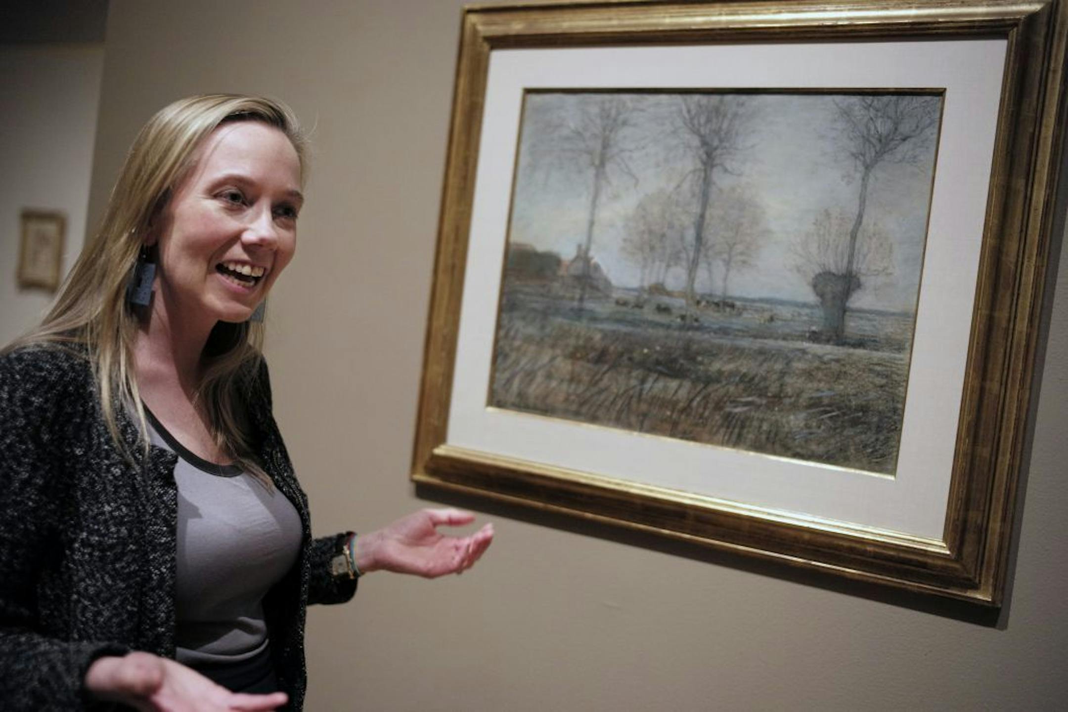 At the Minneapolis Art Institute on July 1, 2014, curator Rachel McGarry is curator of "Marks of Genius:100 Extraordinary Drawings from the Institute of Arts." She is giving historical points on this Mondrian Dutch landscape that was donated to the MIA by Bruce Dayton.