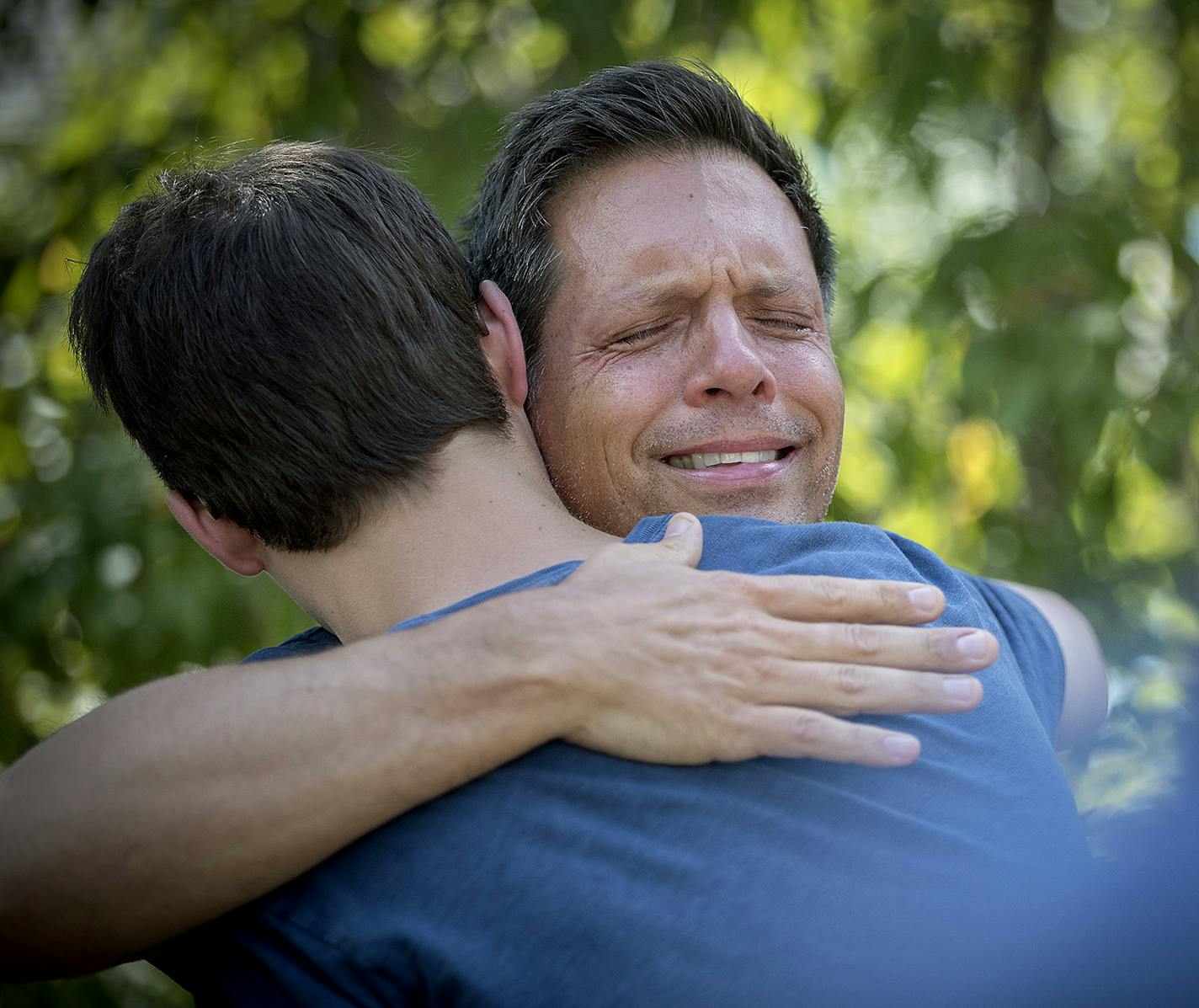 Don Damond is comforted by friends and family after he made a statement to the press near his home after Minneapolis police officer shot and killed his fiance Justine Damond, Monday, July 17, 2017 in Minneapolis, MN. ] ELIZABETH FLORES &#xef; liz.flores@startribune.com