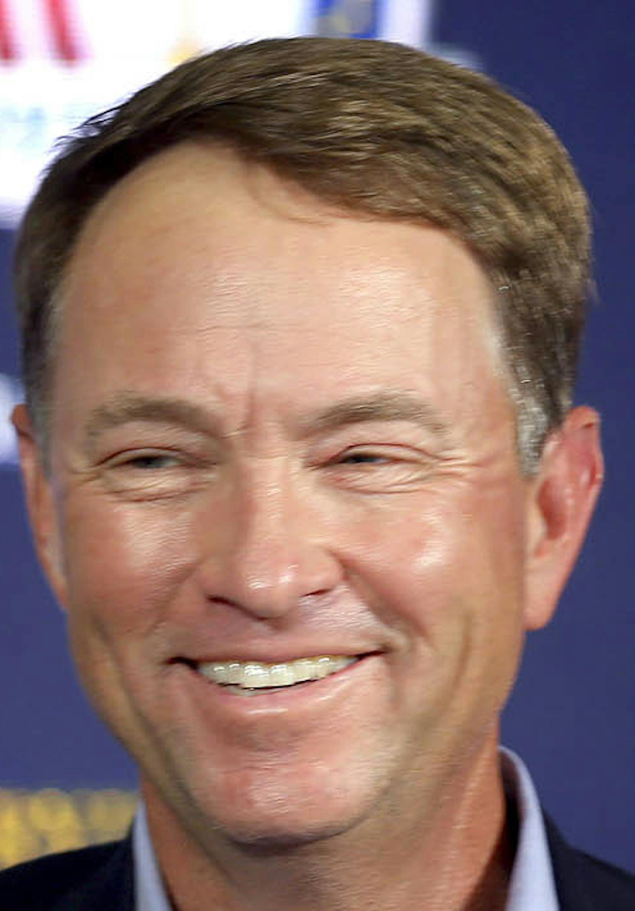 Davis Love III smiles during a news conference announcing him as the 2016 U.S. Ryder Cup captain, at PGA of America, Tuesday, Feb. 24, 2015, in Palm Beach Gardens, Fla. (AP Photo/The Palm Beach Post, Bill Ingram) ORG XMIT: FLPAP321