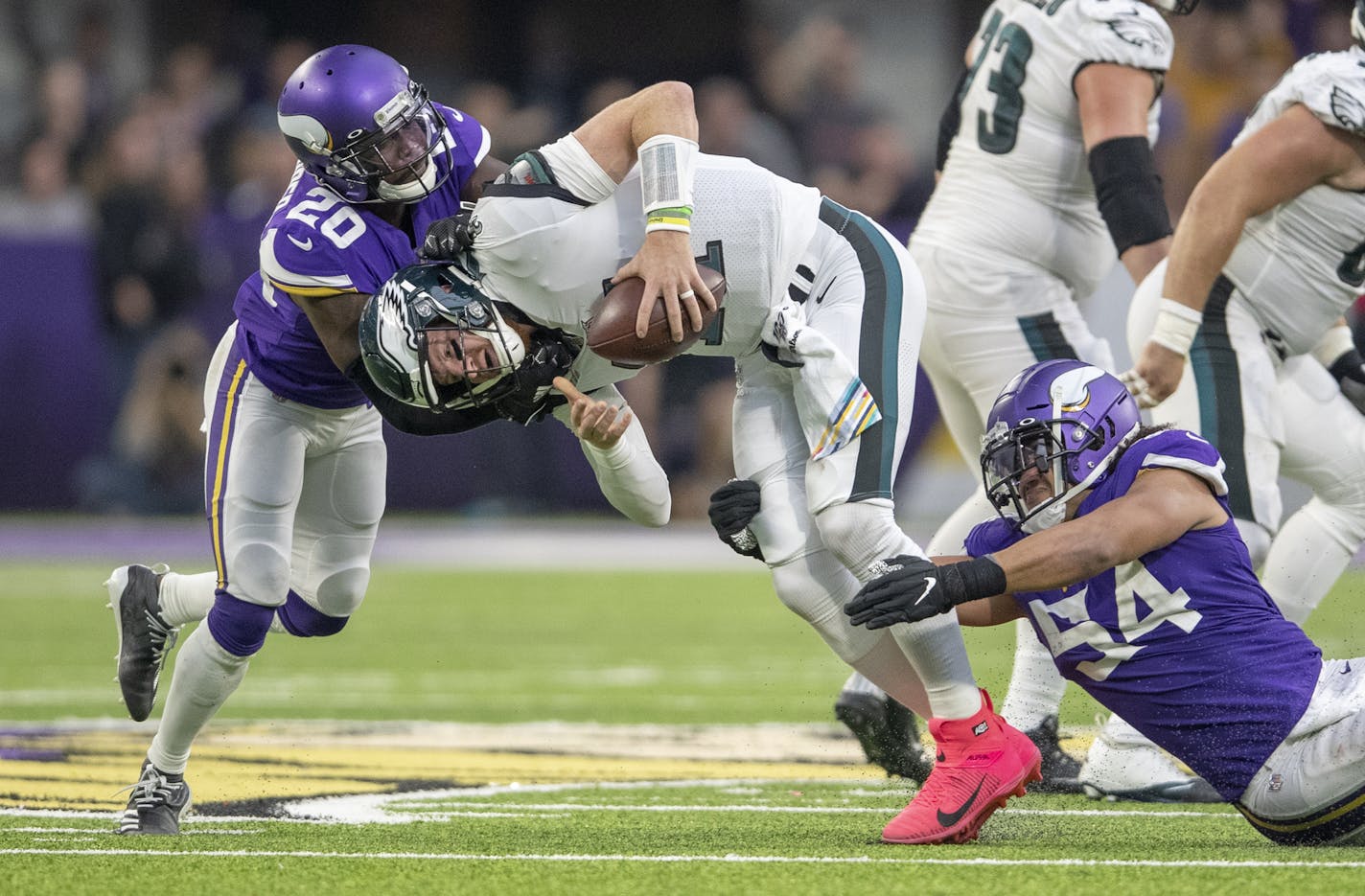 Vikings middle linebacker Eric Kendricks, right, and Vikings cornerback Mackensie Alexander sacked Eagles quarterback Carson Wentz in the fourth quarter. ] ELIZABETH FLORES &#x2022; liz.flores@startribune.com Vikings take on the Philadelphia Eagles at U.S. Bank Stadium, Sunday, October 13, 2019 in Minneapolis, MN.