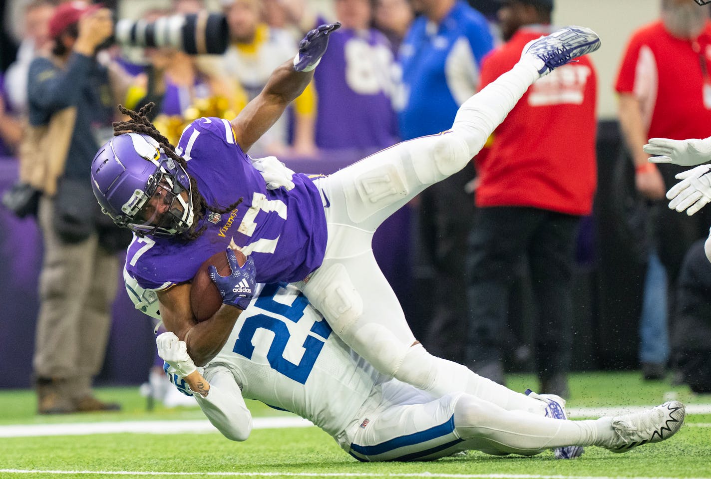 Minnesota Vikings wide receiver K.J. Osborn (17) is tackled by Indianapolis Colts safety Rodney Thomas II (25) after a 63-yard reception in the third quarter Saturday, Dec. 17, 2022 at U.S. Bank Stadium in Minneapolis. The Vikings completed the largest comeback in NFL history after starting the game down 33-0. ]