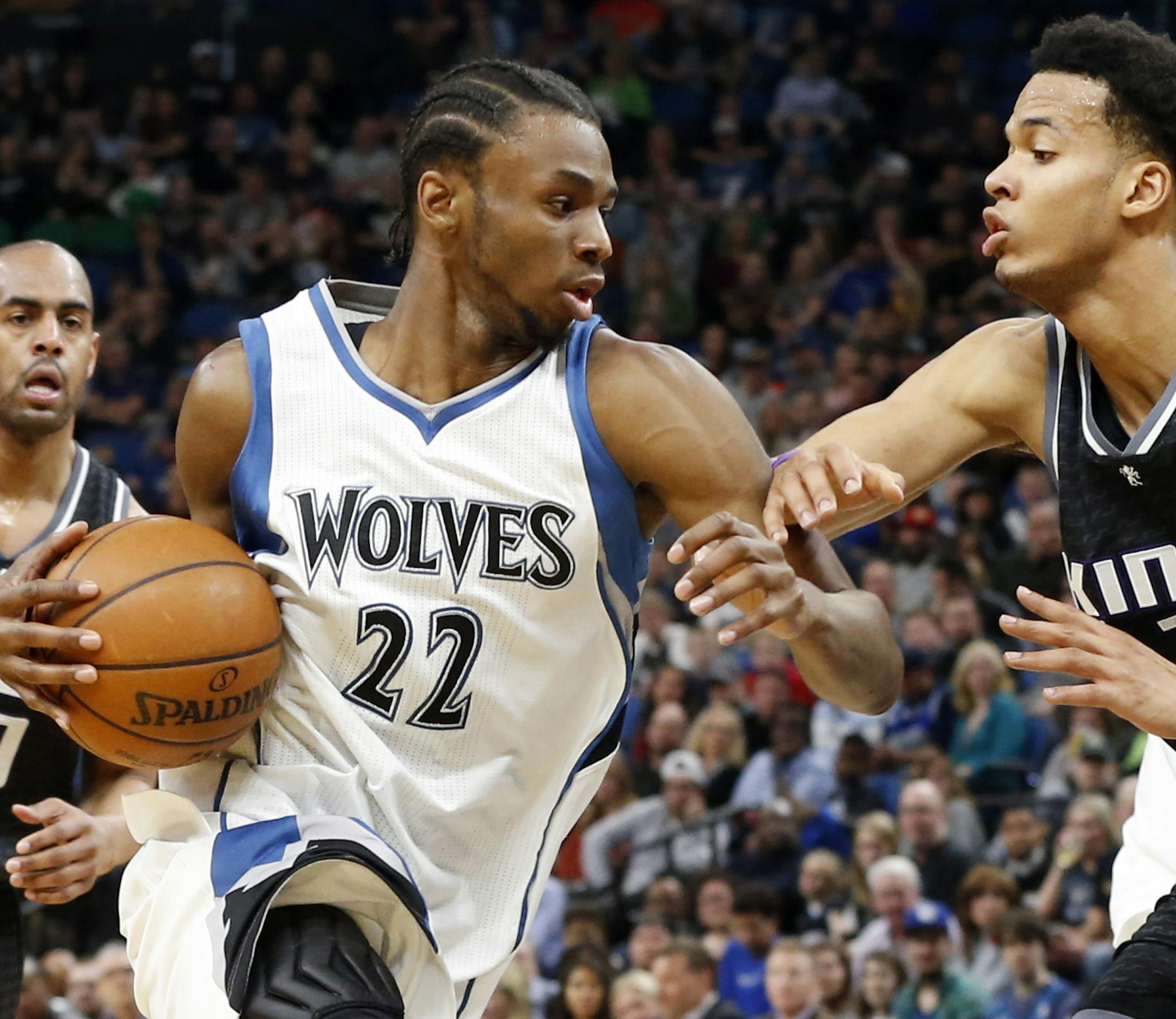Minnesota Timberwolves' Andrew Wiggins, left, drives on Sacramento Kings' Skal Labissiere during the second half of an NBA basketball game Saturday, April 1, 2017, in Minneapolis. The Kings won 123-117. (AP Photo/Jim Mone)