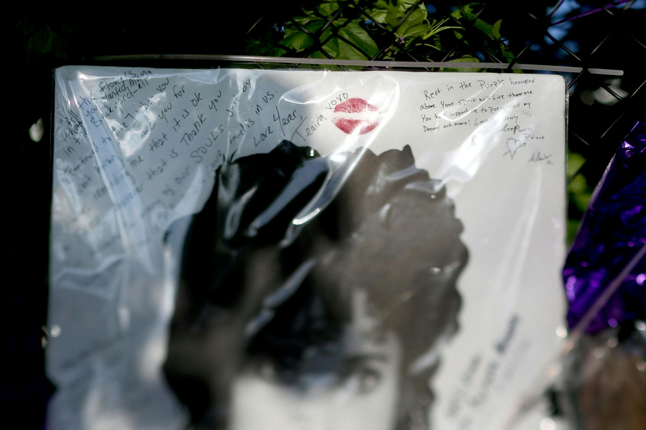 A lipstick kiss on a piece of art left behind outside Paisley Park Sunday, May 15, 2016, in Chanhassen, MN.
