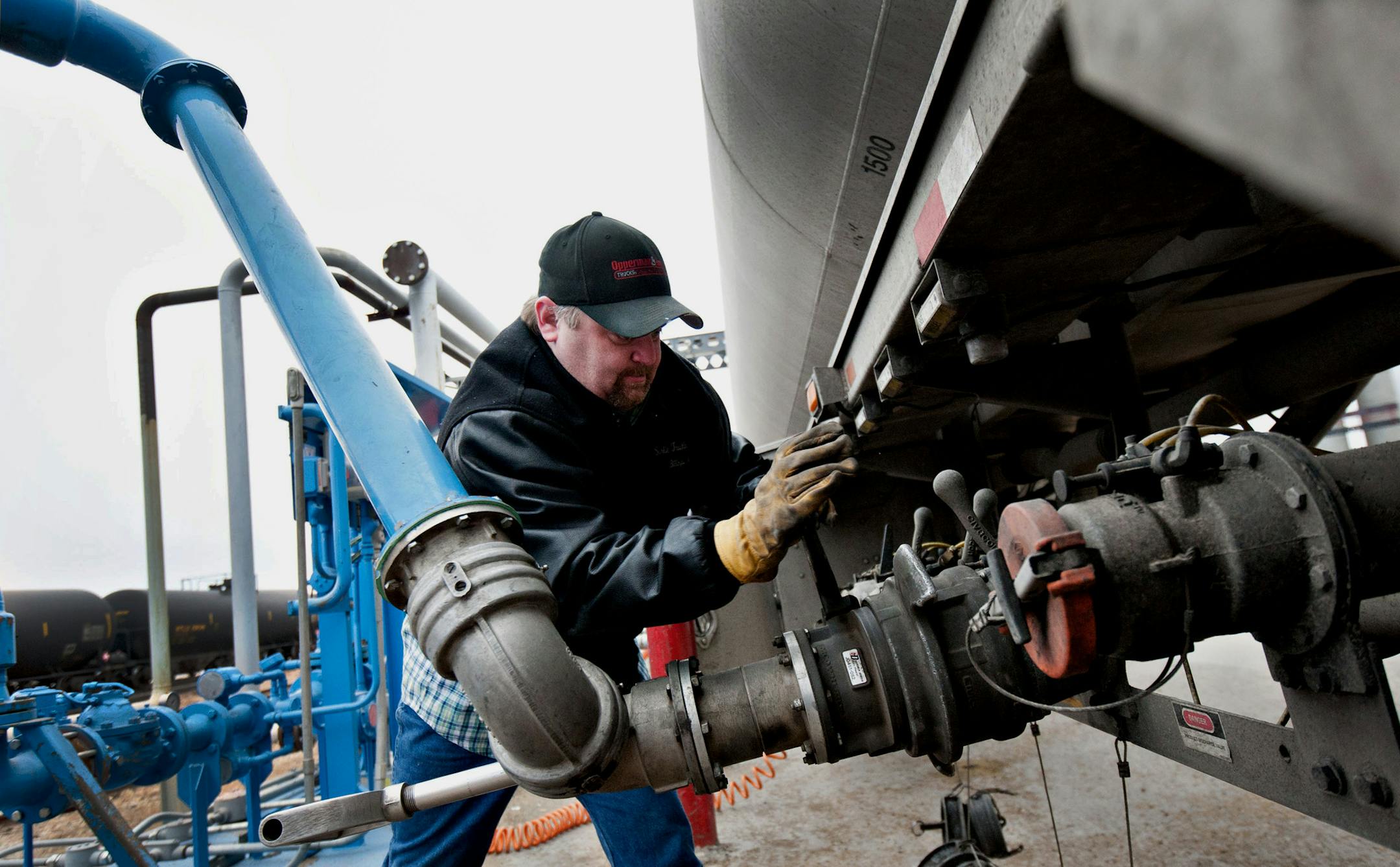 Shawn Davis, driver for Sorlie Trucking, loads a tanker trailer with denatured alcohol, or ethanol, at the Great River Energy Blue Flint Ethanol plant in Underwood, North Dakota, U.S., on Thursday, Feb. 9, 2012. North Dakota will hold its Republican presidential caucus on March 6. Photographer: Daniel Acker/Bloomberg *** Local Caption *** Shawn Davis ORG XMIT: 140227233