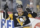 Pittsburgh Penguins' Jake Guentzel (59) celebrates his first goal in the NHL on his first shot in his first NHL shift during the first period of an NH