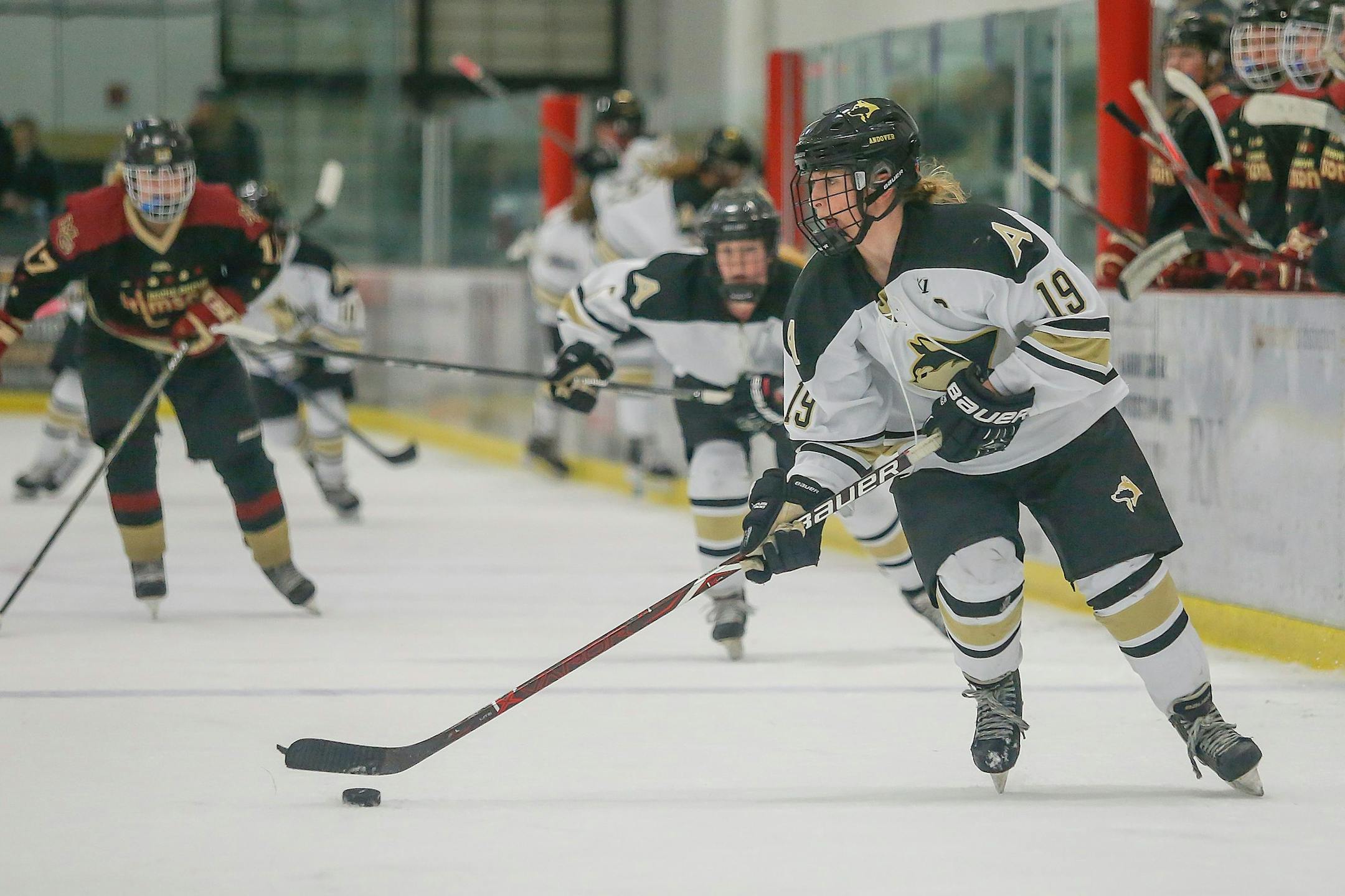 Andover forward Claire Butorac, senior, carries the puck in a Jan. 9 home game against Maple Grove. Photo by Mark Hvidsten, SportsEngine