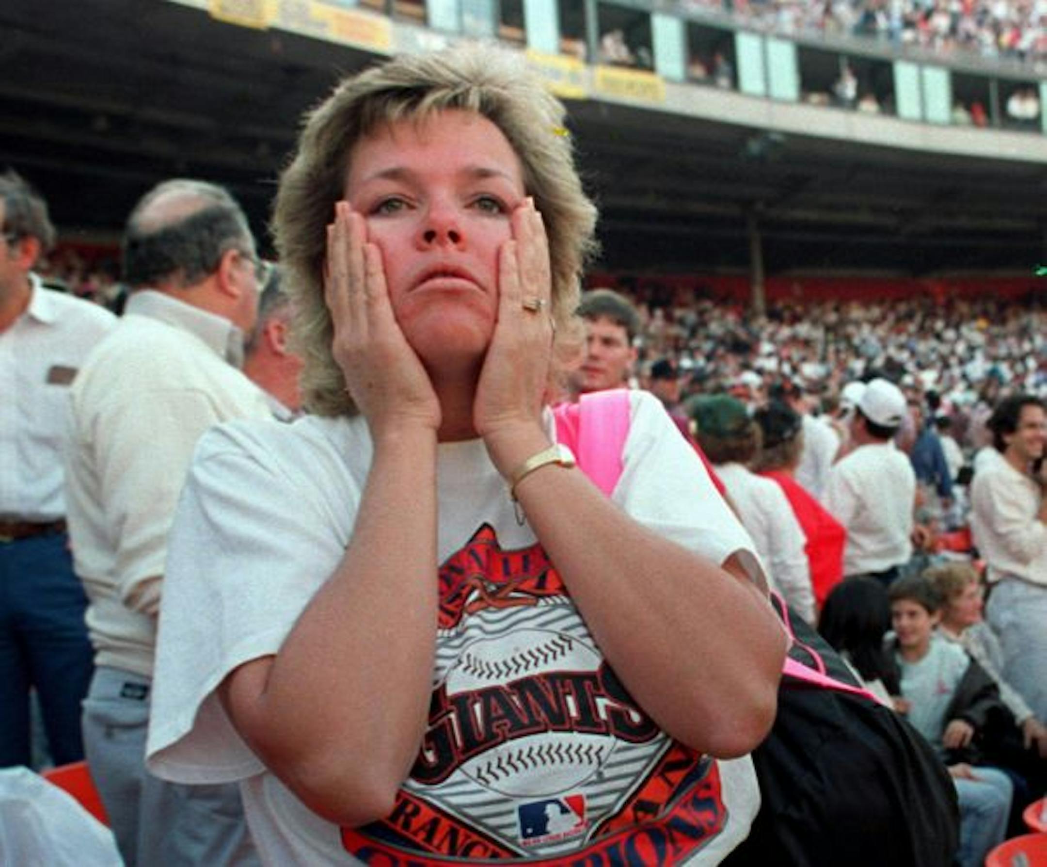 At Candlestick Park, the World Series was suddenly forgotten. A fan reacts to the shaking at the park in October 1989 just after the Loma Prieta earthquake.