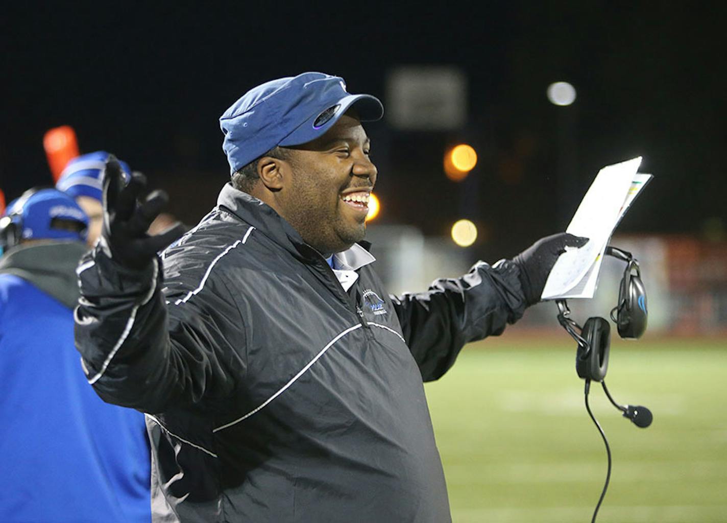 Minneapolis North High Charles Adams, who is also a Minneapolis police officer, celebrates a team touchdown during a game with St. Paul Central in St. Paul, MN, Friday, Sept. 18, 2015..](DAVID JOLES/STARTRIBUNE)djoles@startribune.com Minneapolis North High is headed to the State Prep Bowl championships.