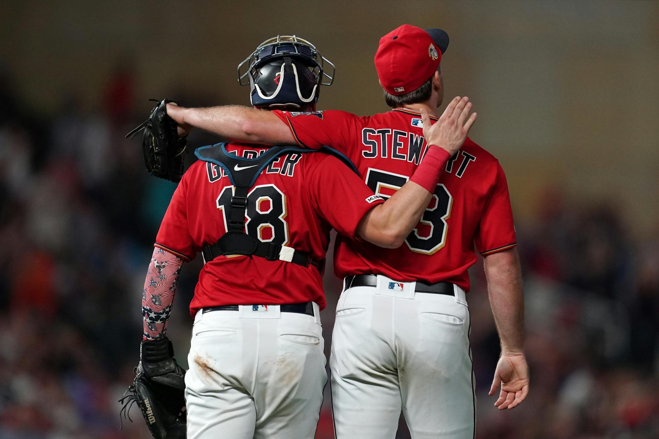 Minnesota Twins closing pitcher Kohl Stewart (53) celebrated with Minnesota Twins catcher Mitch Garver (18) after getting the win.