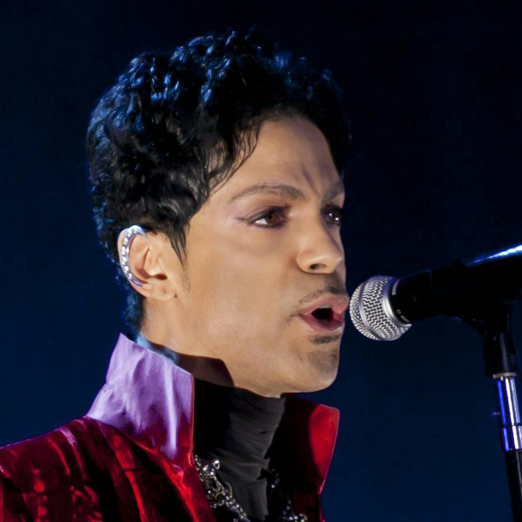 In this picture made available on Wednesday, Aug. 10, 2011, US musician Prince performs during his concert at the Sziget Festival on the Shipyard Island, northern Budapest, Hungary, on Tuesday, Aug. 9, 2011. The Sziget Festival is one of the biggest European cultural events, featuring art exhibitions, literary and theatrical performances, and above all music concerts. The festival runs from Aug. 8 to 15. (AP Photo/MTI, Balazs Mohai) HUNGARY OUT