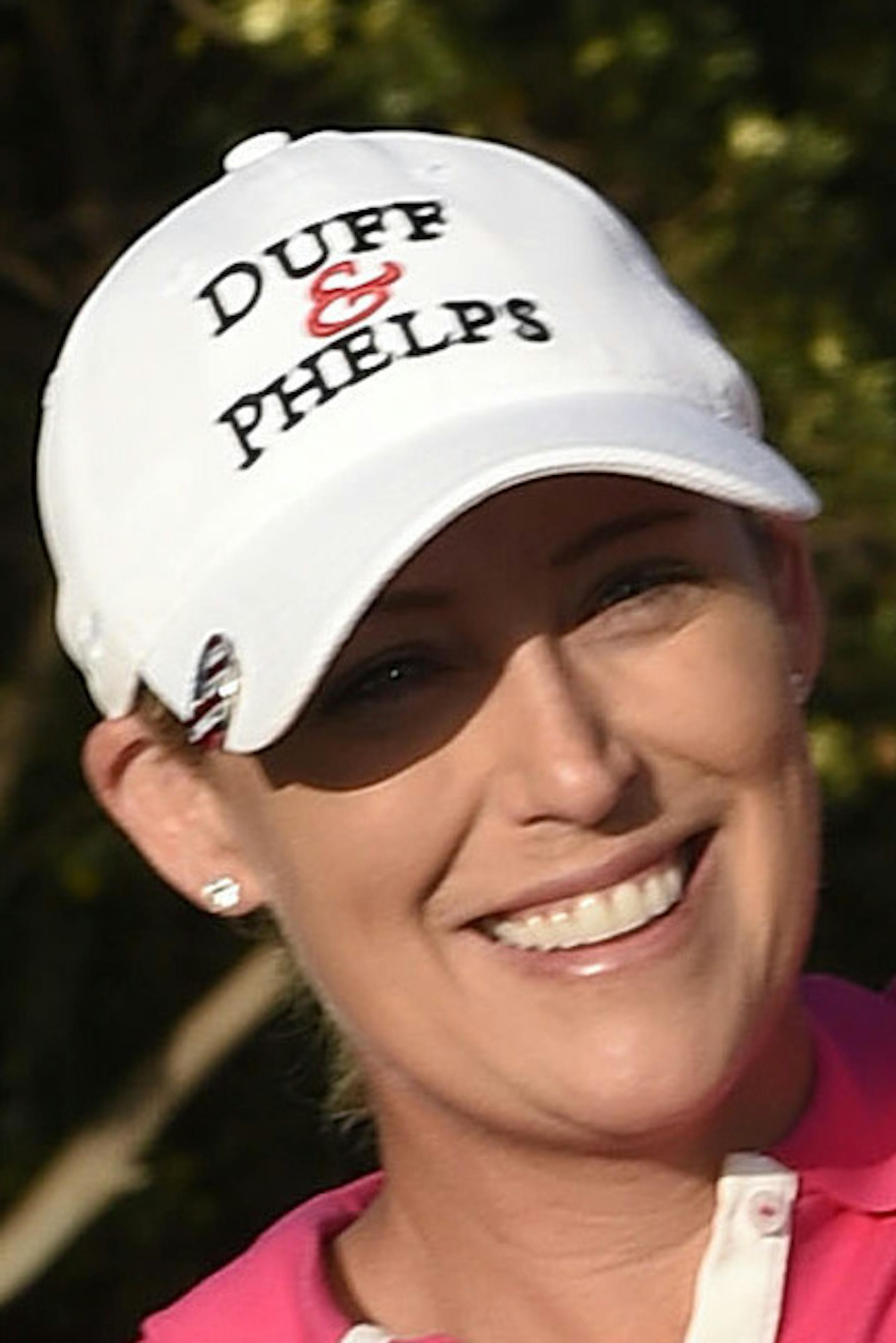 Cristie Kerr holds up the trophy after winning the LPGA Kia Classic golf tournament Sunday, March 29, 2015 in Carlsbad, Calif. (AP Photo/Denis Poroy)