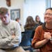 Bobby Byrne, a senior, listens to Gloriana Ye, a senior, as she leads a small circle discussion as part of a Death Cafe meeting at St. Olaf College Bu